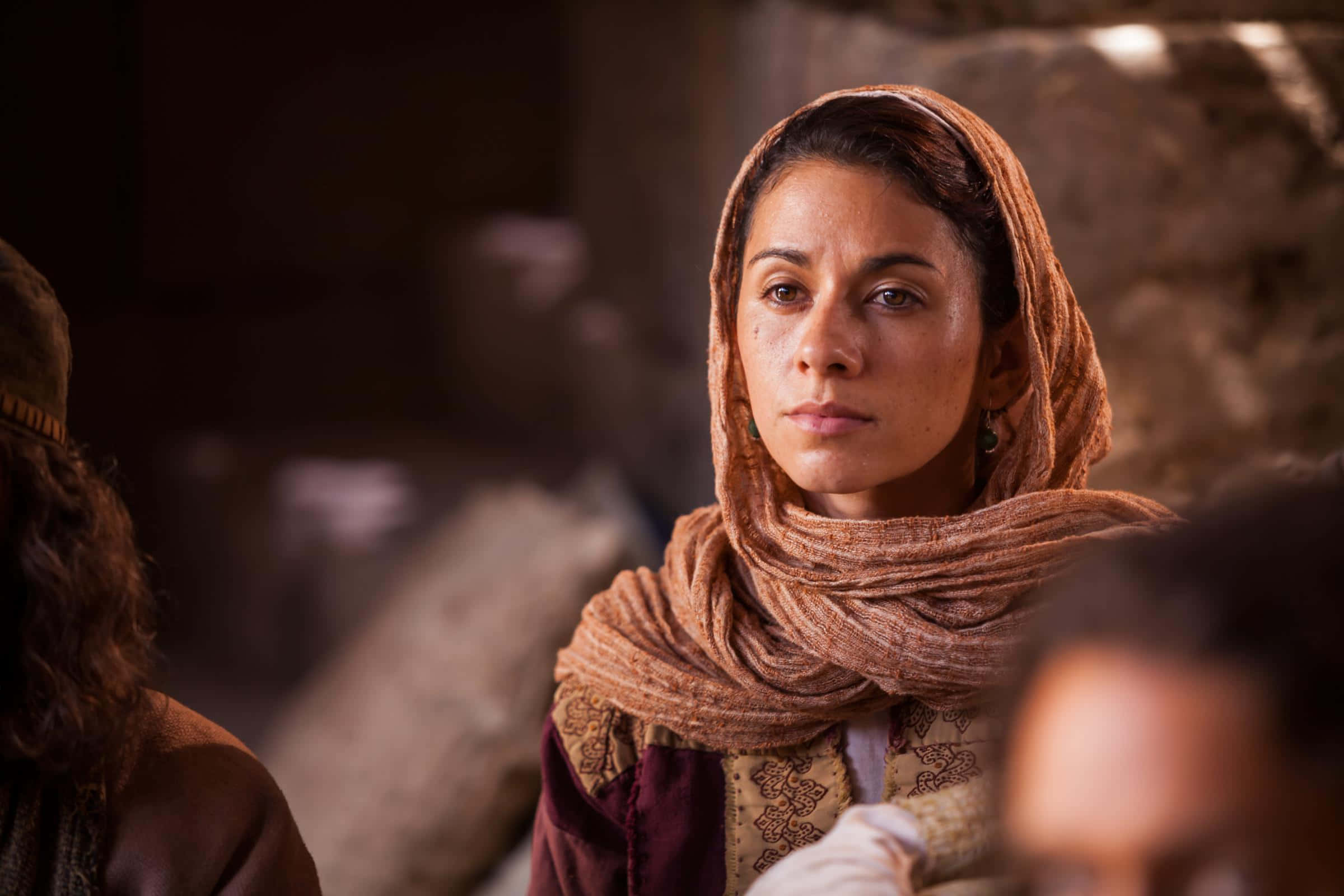 Mary Magdalene, warm-toned headscarf, dimly lit rustic stone setting, Full HD Desktop Wallpaper
