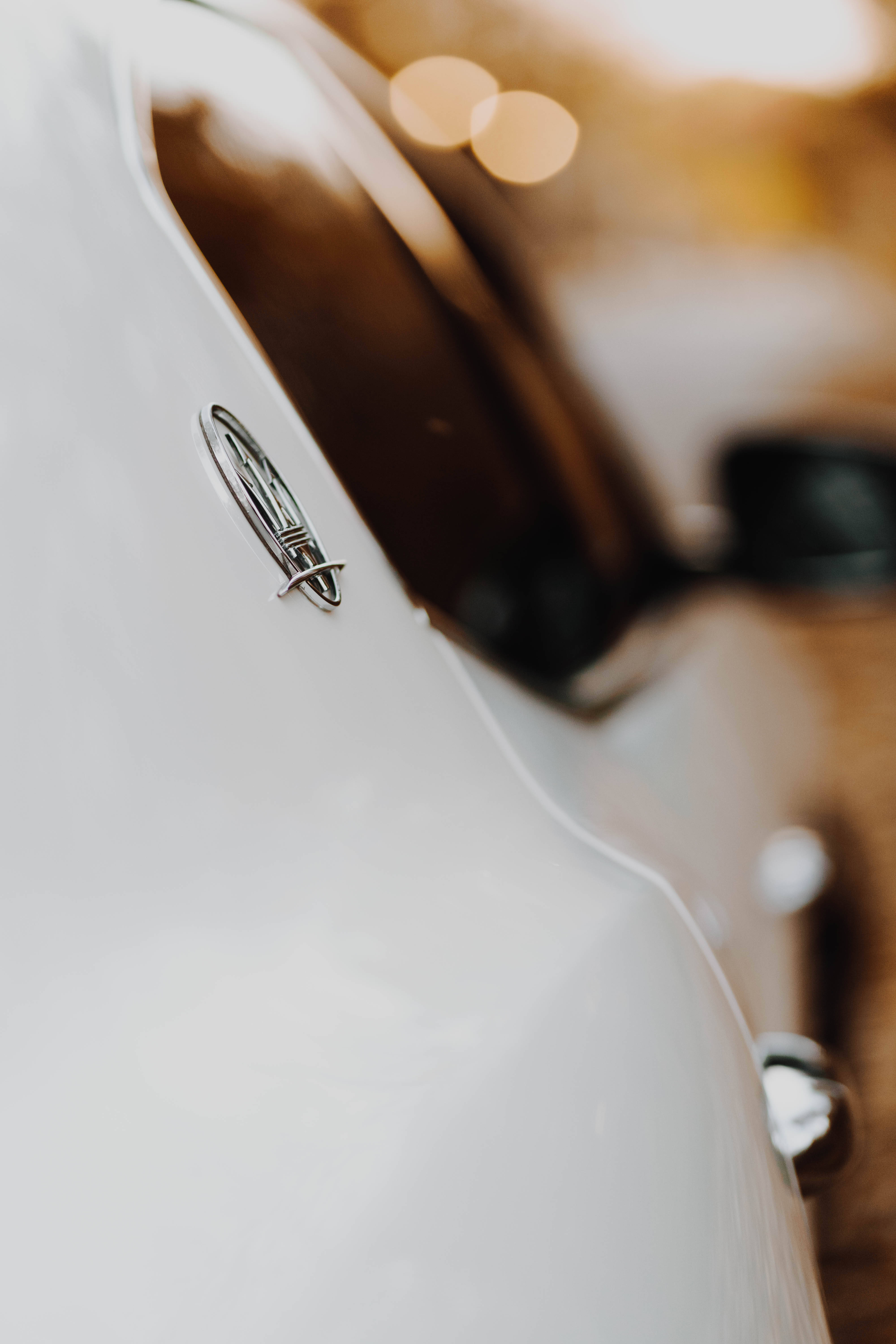 Maserati, metal emblem, sleek white car, 5K Phone Wallpaper
