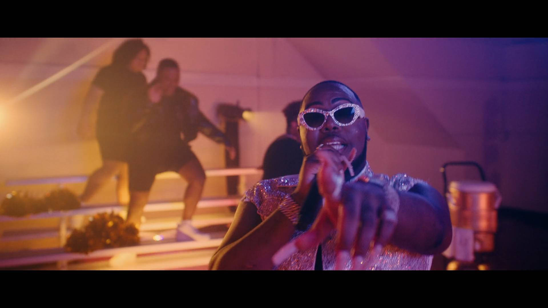 Material Gworl, sparkly sunglasses, vibrant purple and orange stage lights, Full HD Desktop Wallpaper