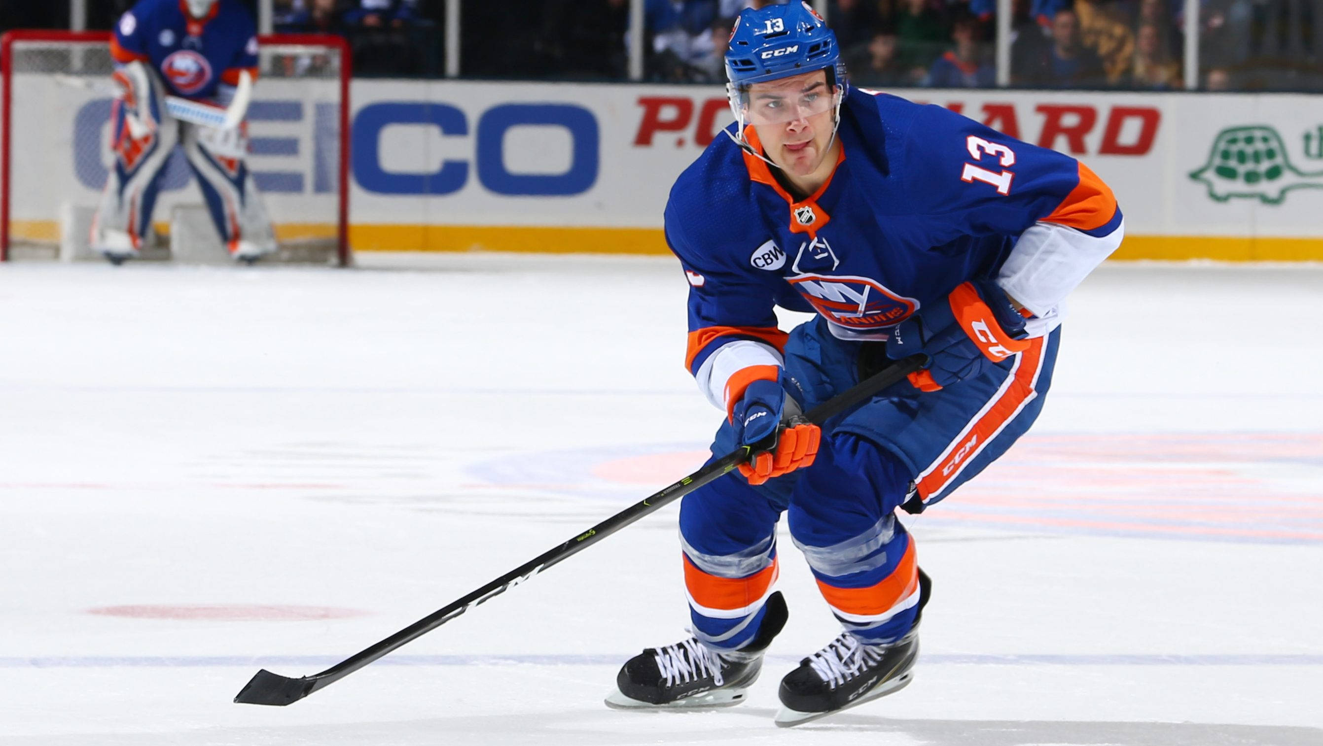 Mathew Barzal, blue and orange gear, puck in stick, 2K Desktop Wallpaper