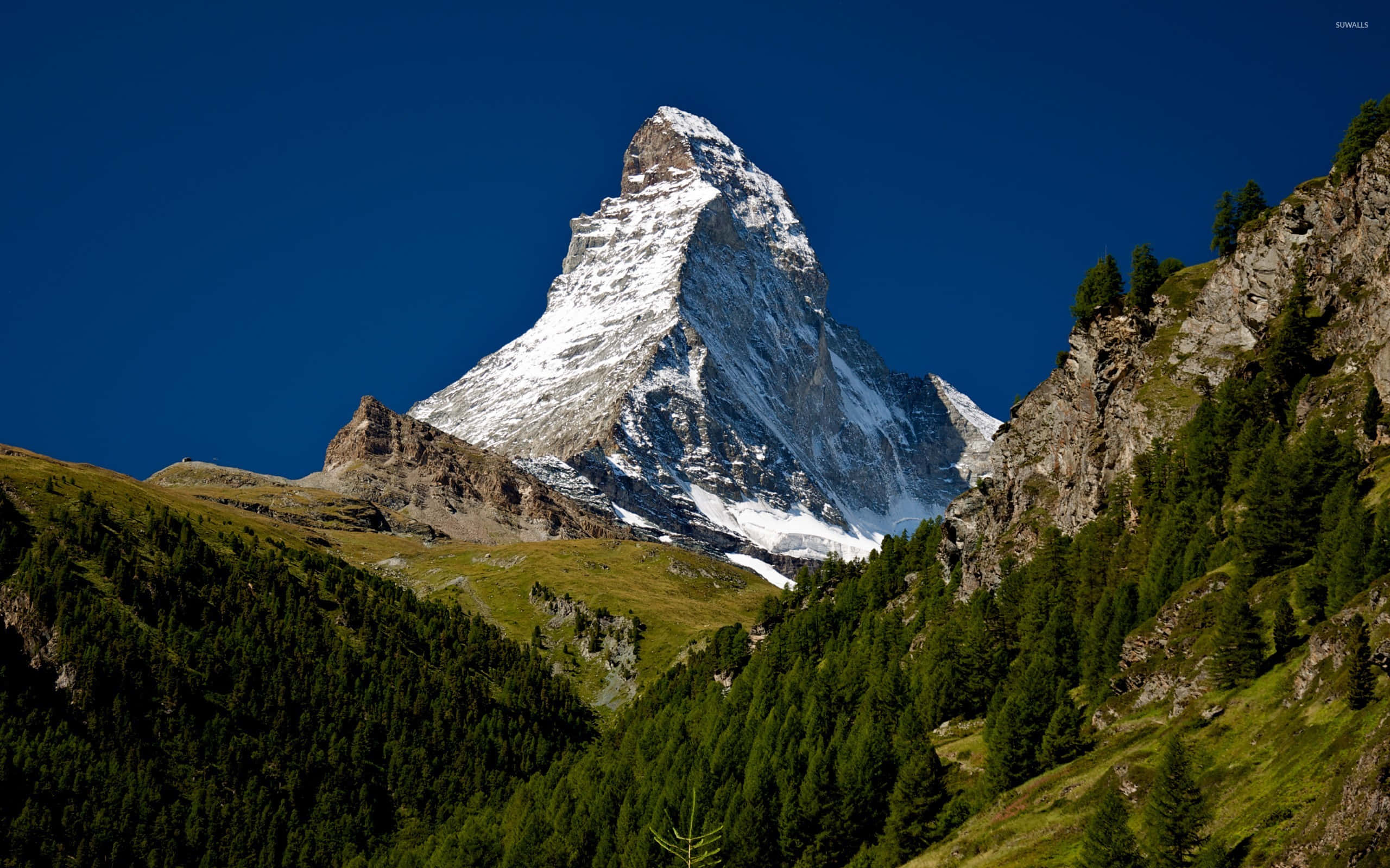 Matterhorn, deep blue sky, lush green slopes, 2K Desktop Wallpaper