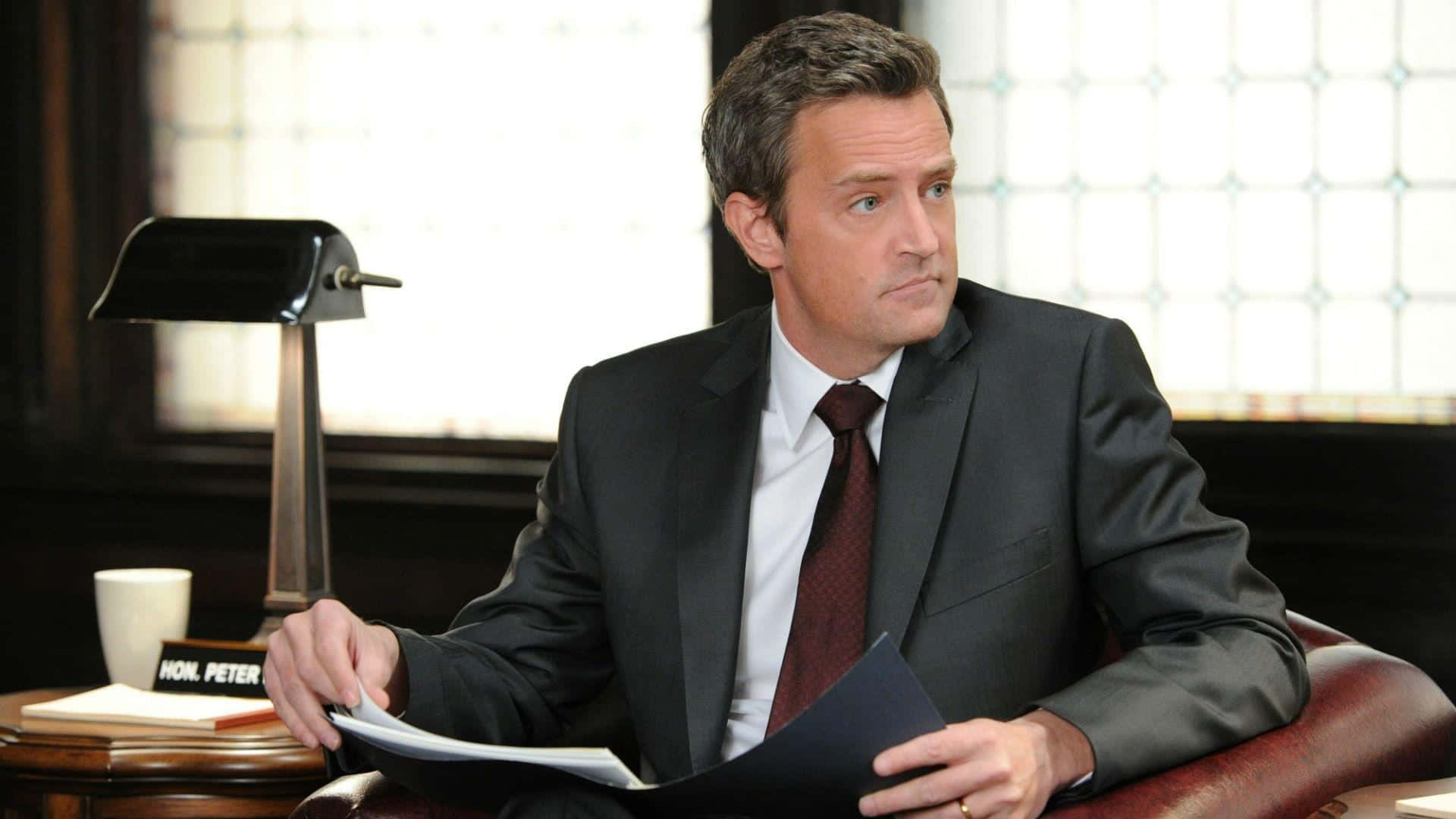 Matthew Perry, dark suit, wooden desk, Full HD Desktop Wallpaper