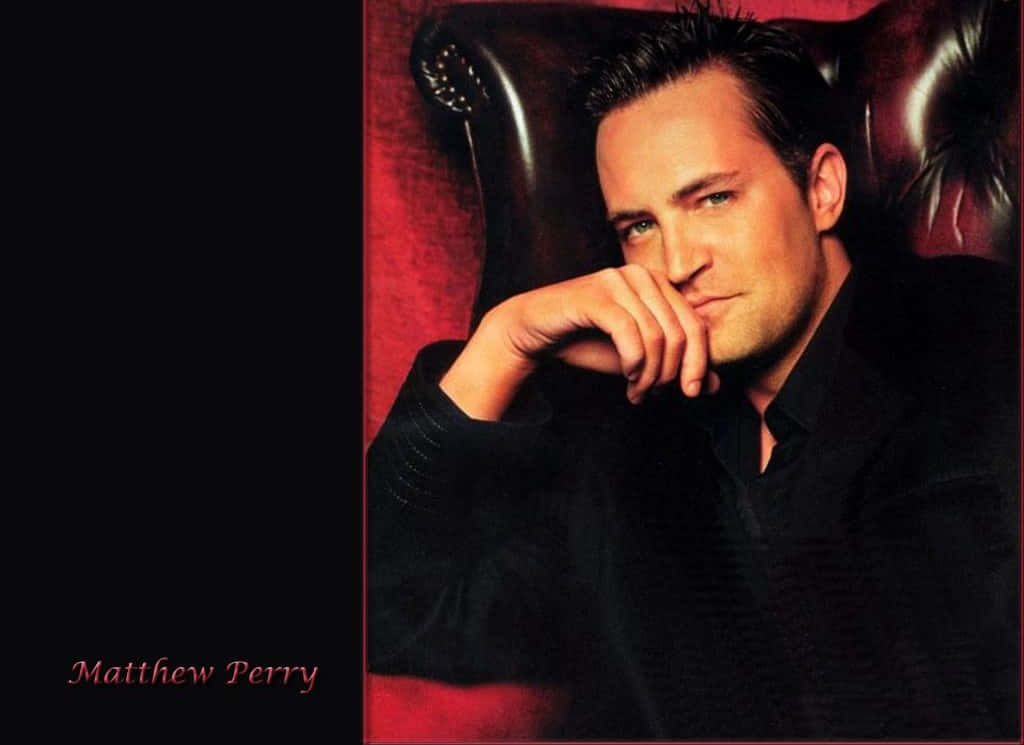 Matthew Perry, dark suit, rich red leather chair, SD Desktop Wallpaper
