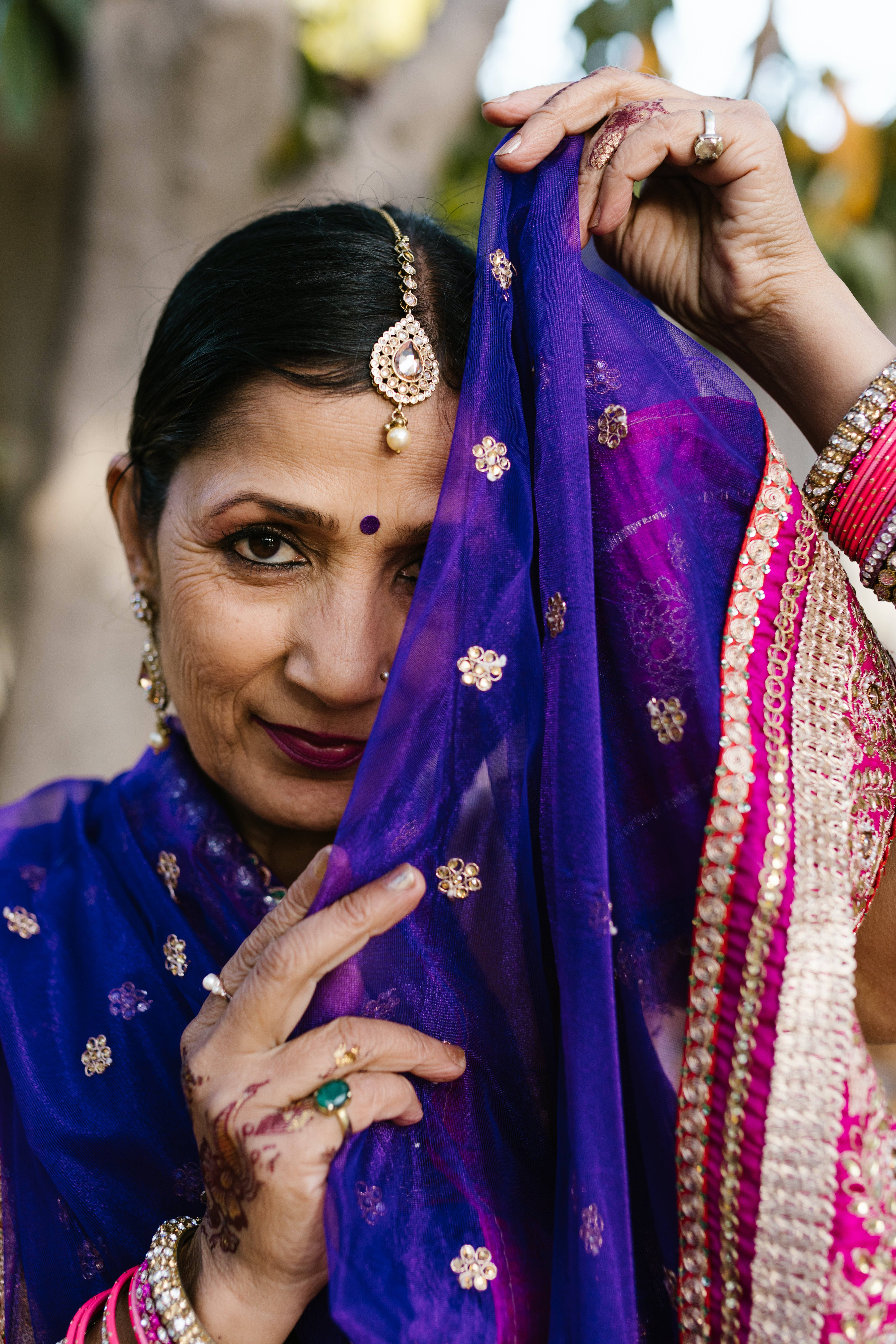 vibrant traditional attire, purple embroidered dupatta, gold floral motifs, 5K Phone Wallpaper