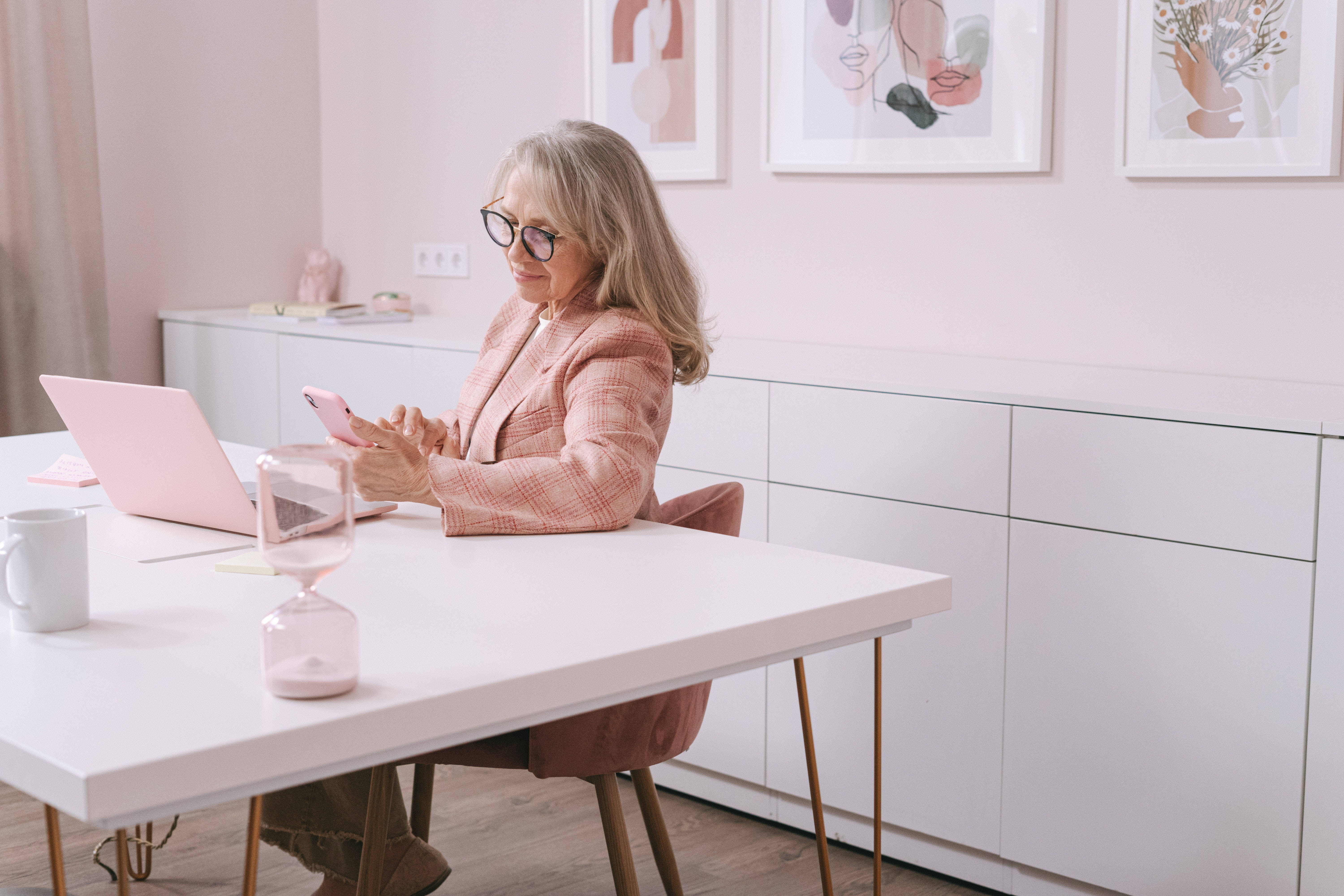 mature woman, pink office, white desk, 5K Desktop Wallpaper