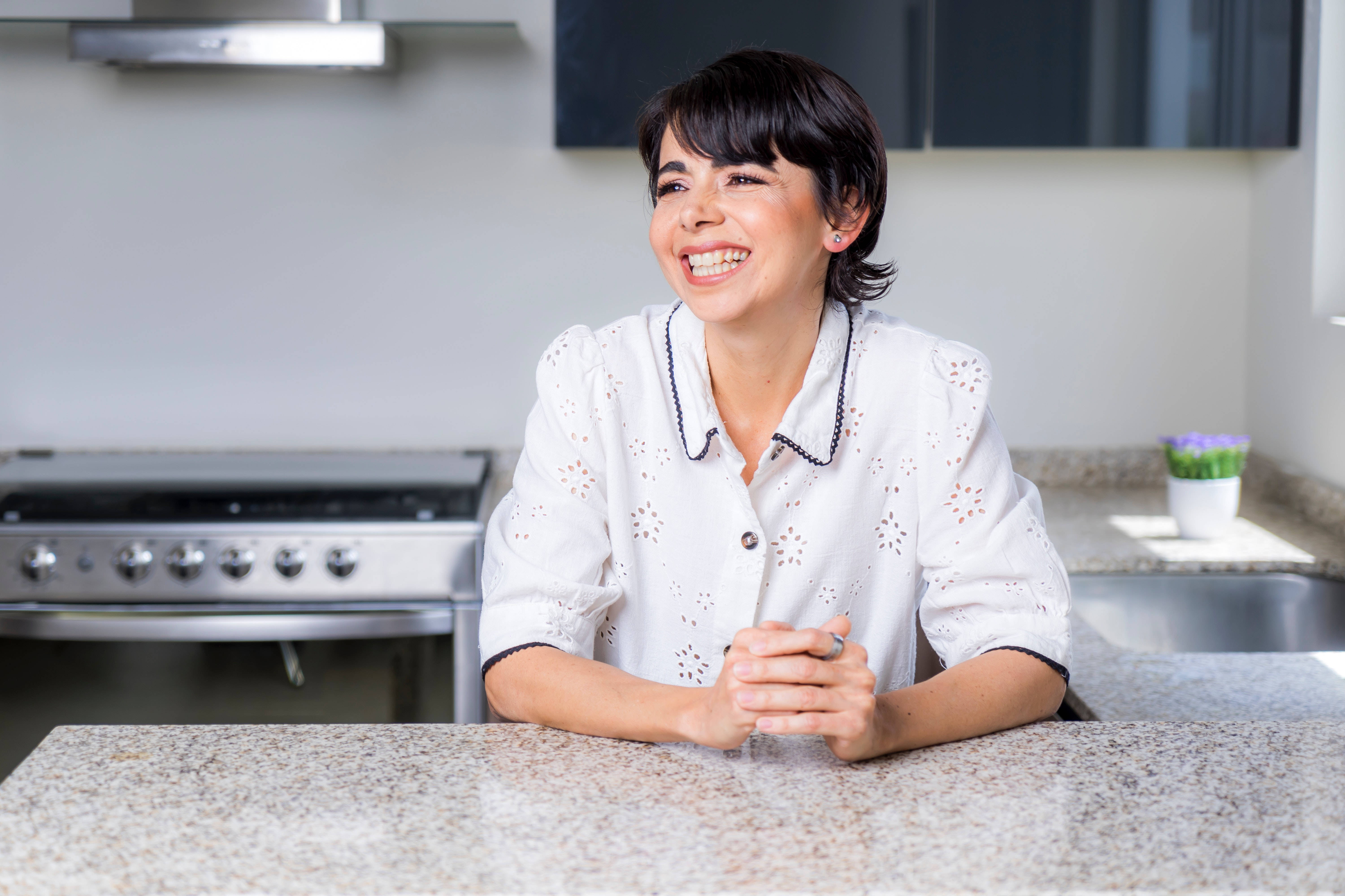 Mature Woman, short dark hair, granite kitchen counter, 5K Desktop Wallpaper