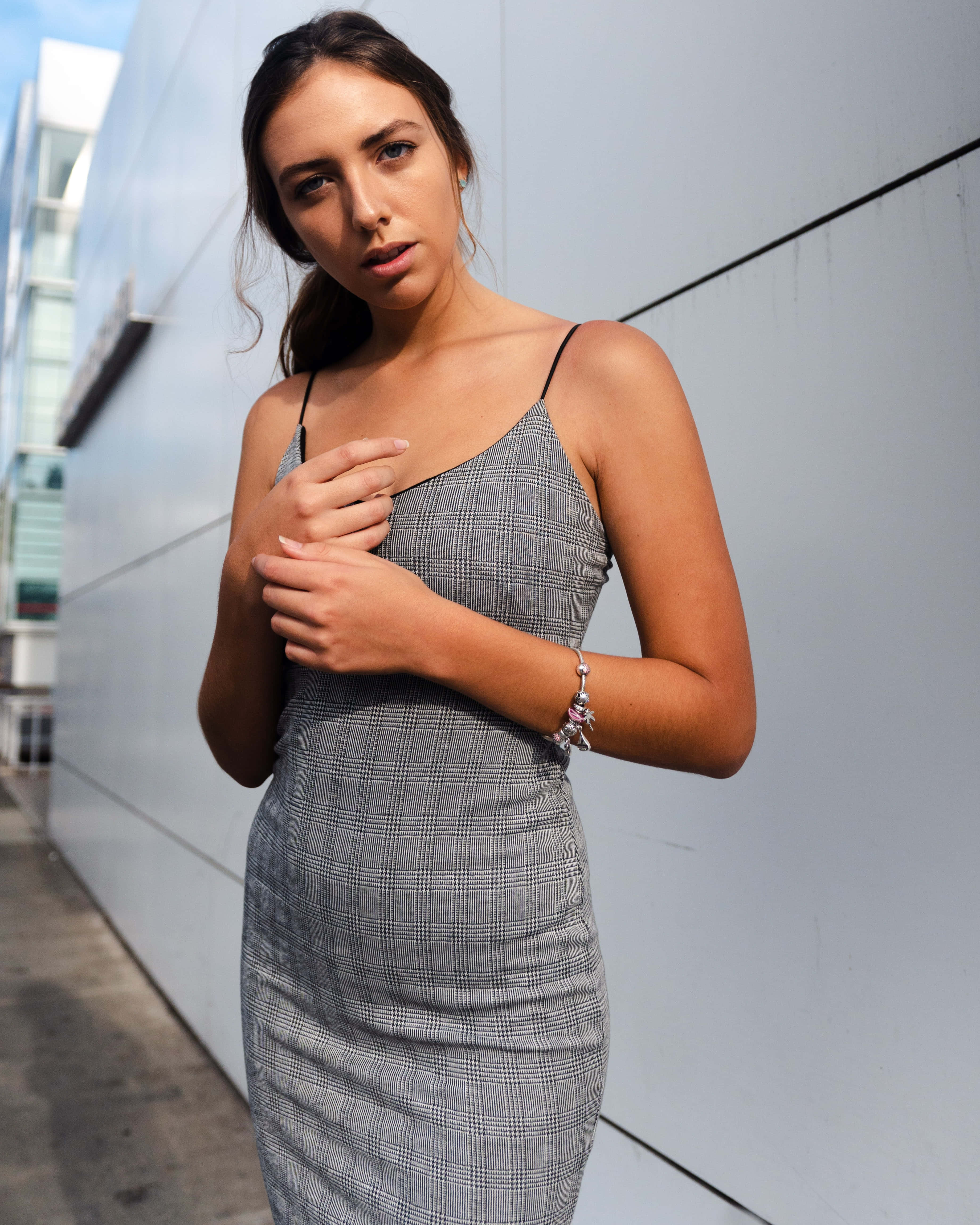 curvy mujer madura, grey plaid dress, sleek white urban wall, 4K Phone Wallpaper