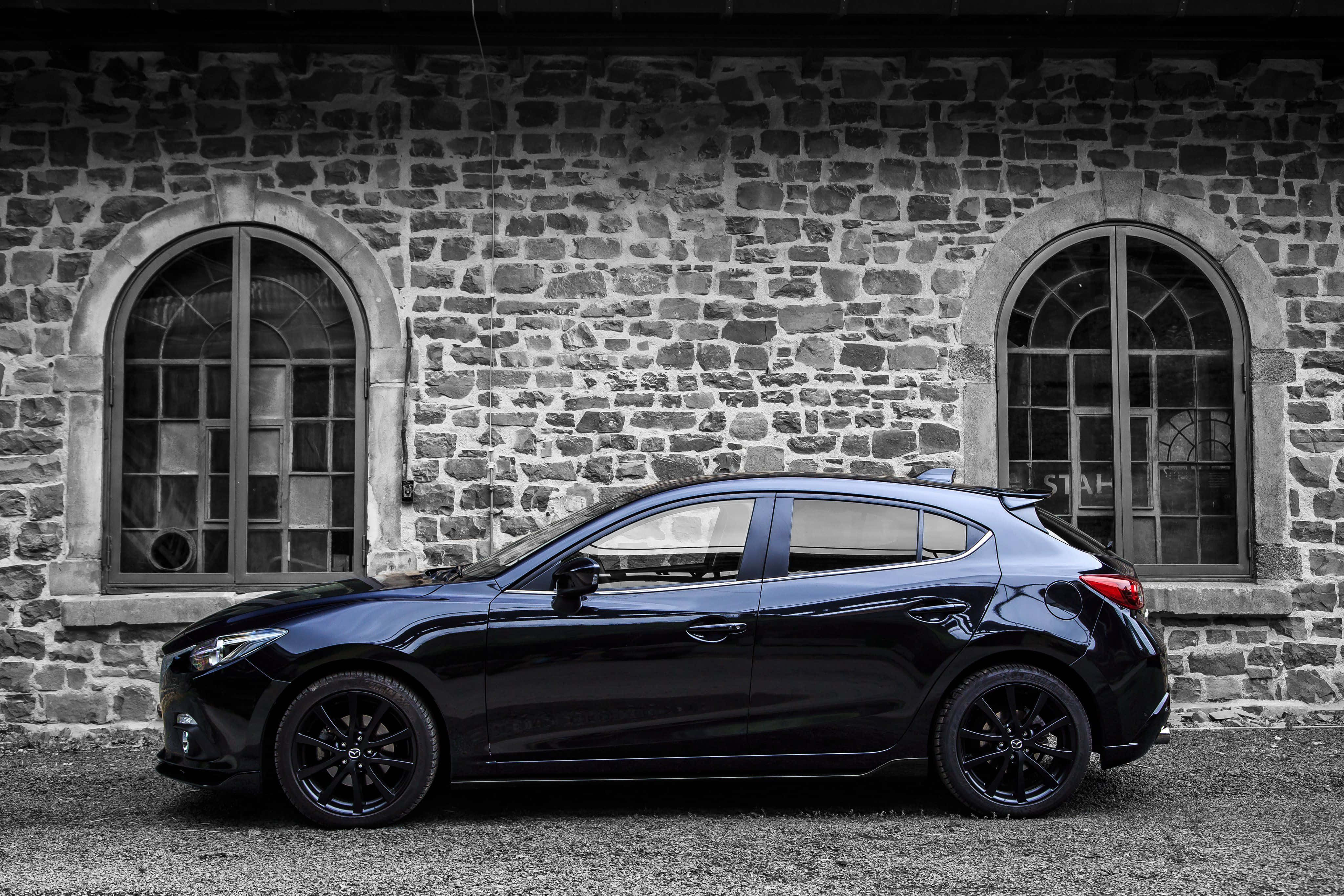 Mazda 3 Hatchback, black, rustic stone building, 4K Desktop Wallpaper
