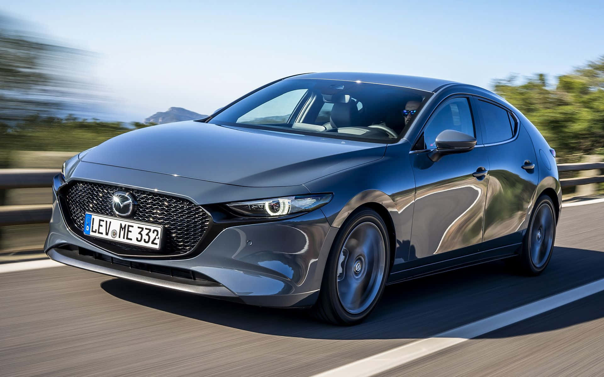 Mazda 3 Hatchback, sleek gray, sunlit coastal road, Full HD Desktop Wallpaper