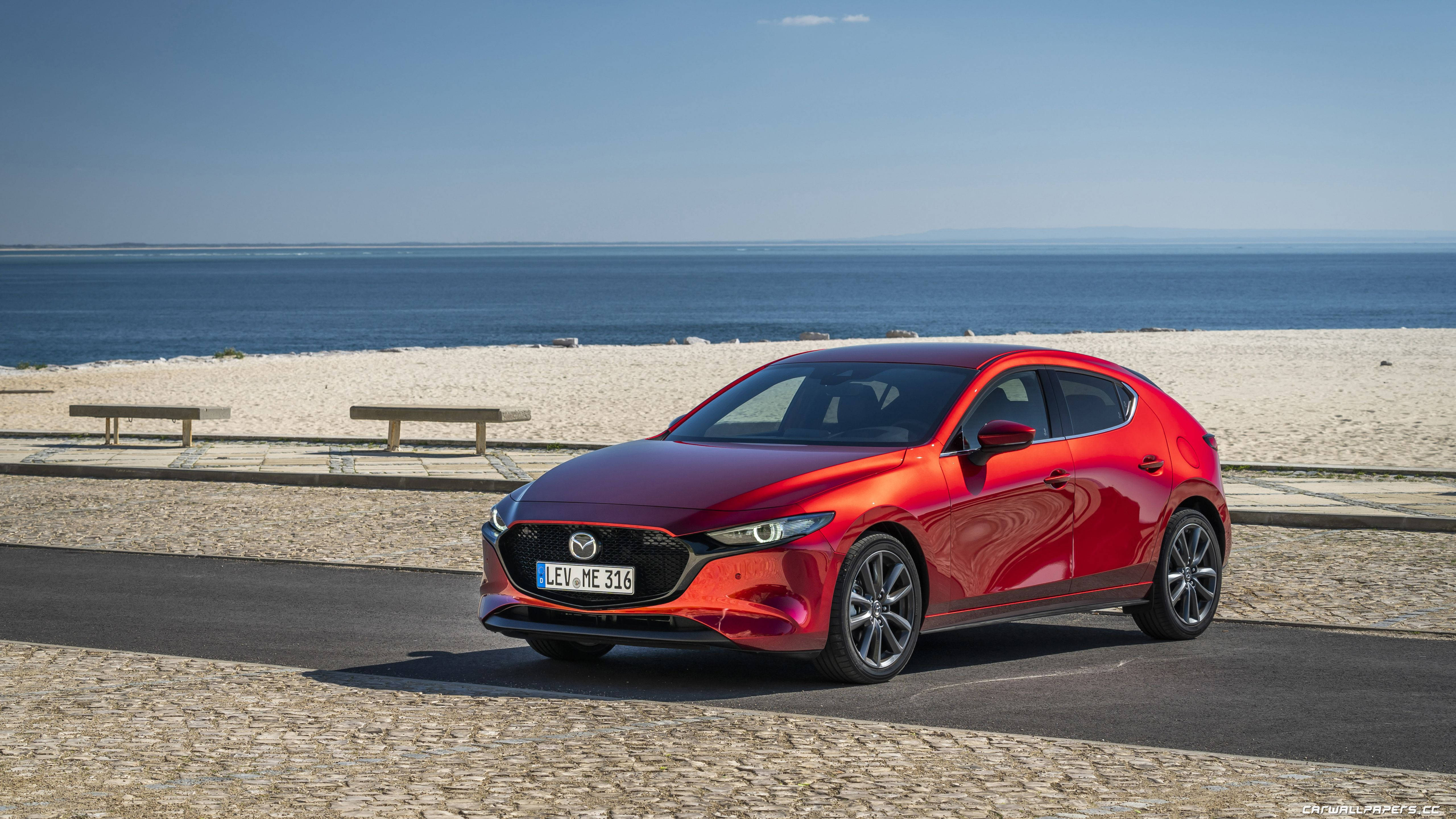 red Mazda 3 Hatchback, coastal road, sandy beach, 5K Desktop Wallpaper