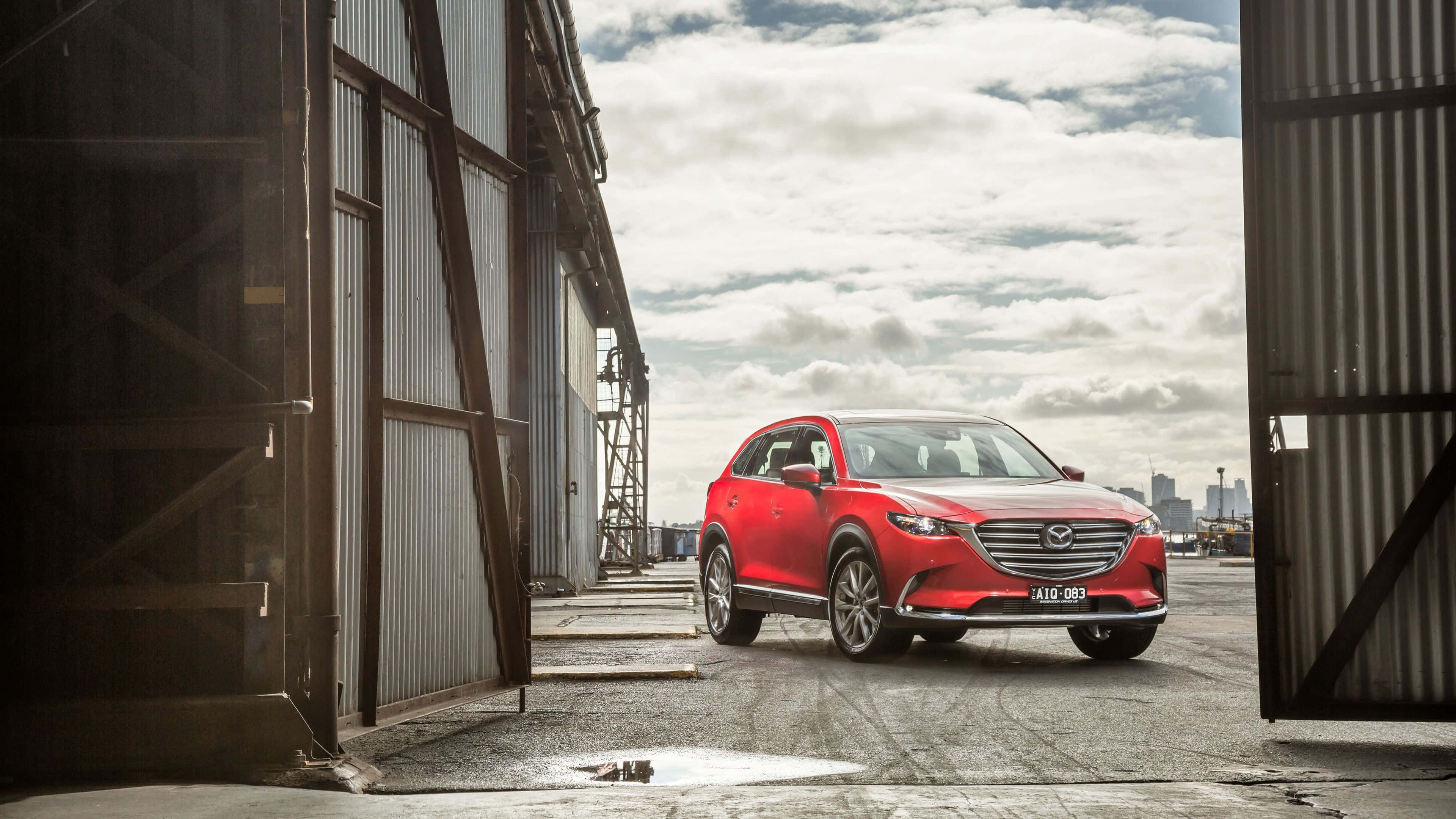 Mazda CX-9, vibrant red, industrial metal doors, 4K Desktop Wallpaper
