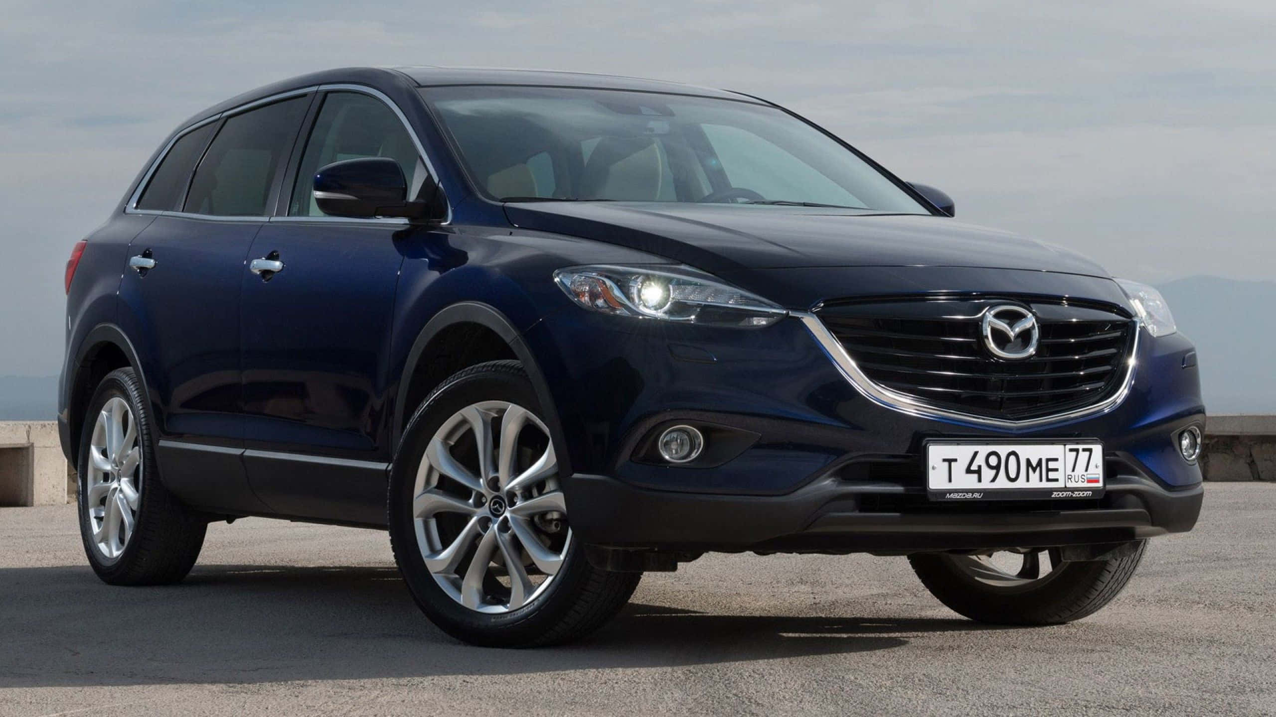 Mazda CX-9, dark blue, concrete surface, 2K Desktop Wallpaper