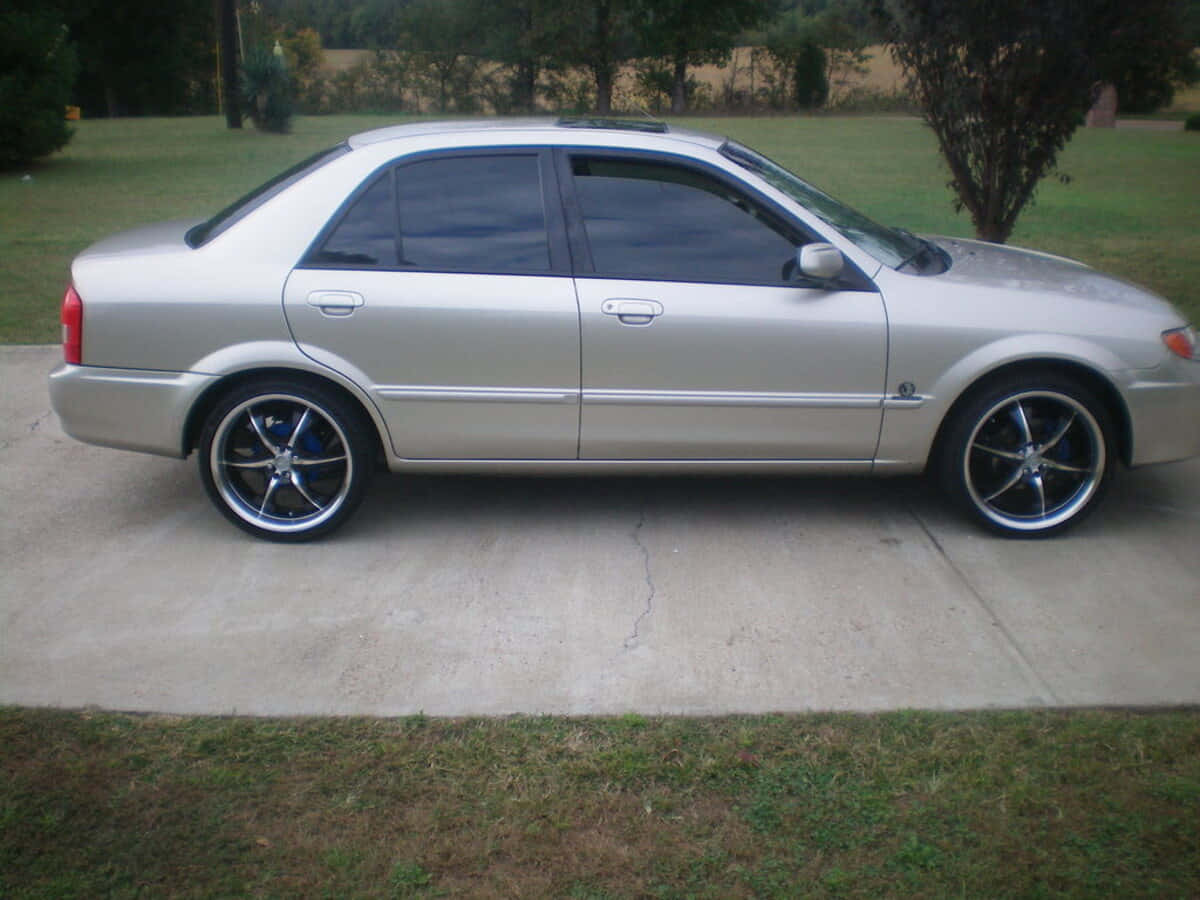 Mazda Protege, silver, custom black wheels, SD Desktop Wallpaper