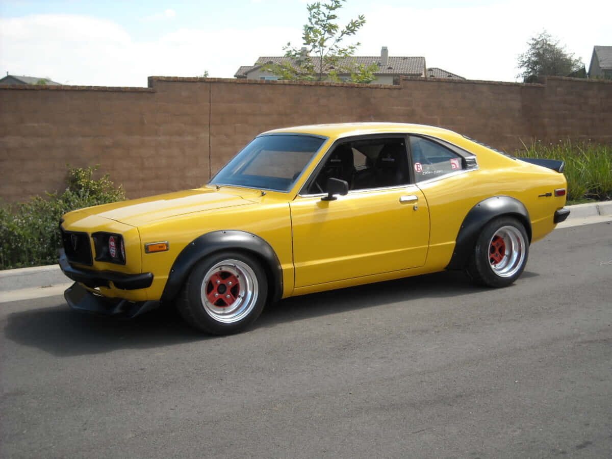 Mazda RX-3, bright yellow, red wheels, SD Desktop Wallpaper