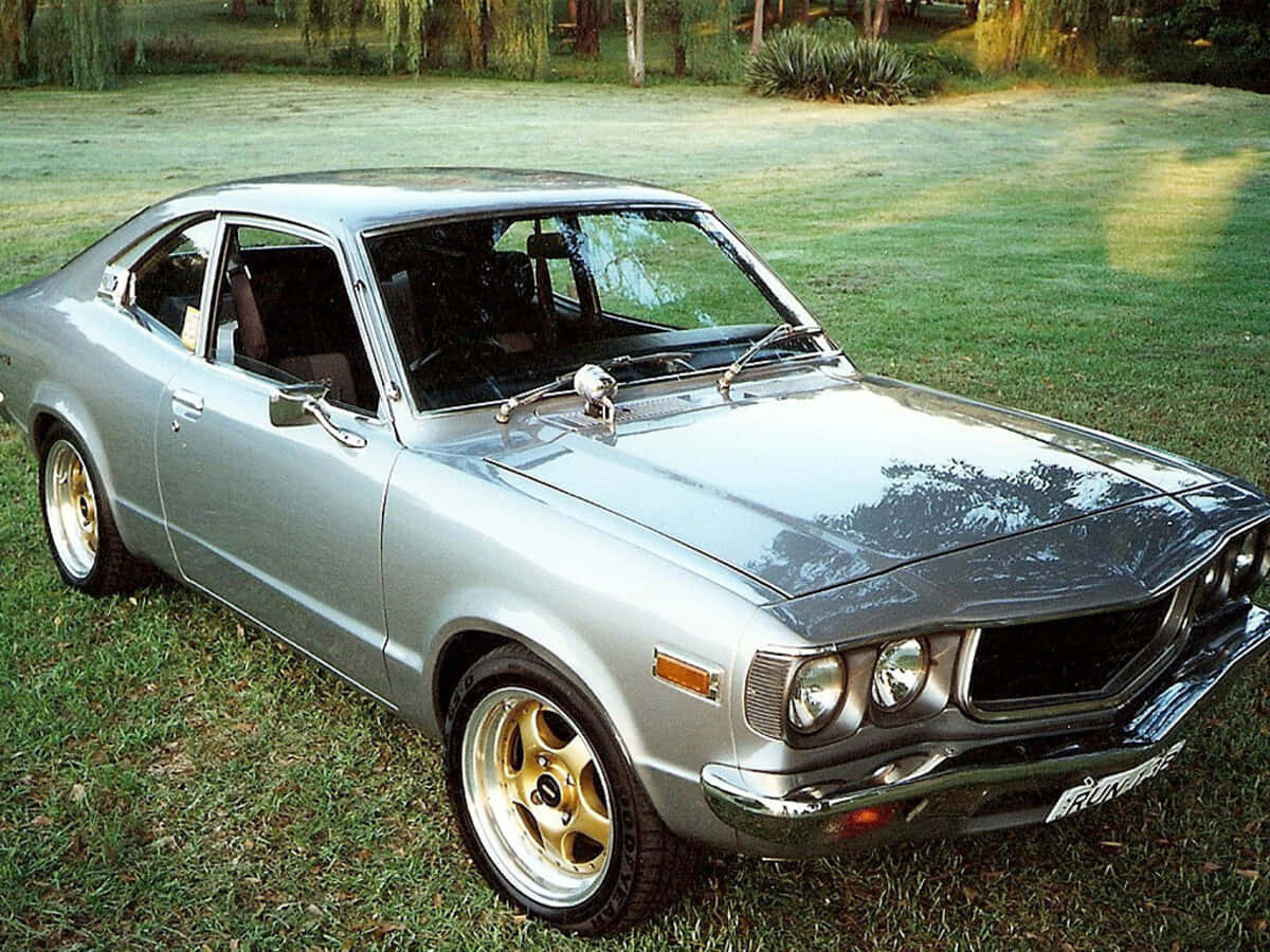 Mazda RX-3, silver, gold wheels, SD Desktop Wallpaper