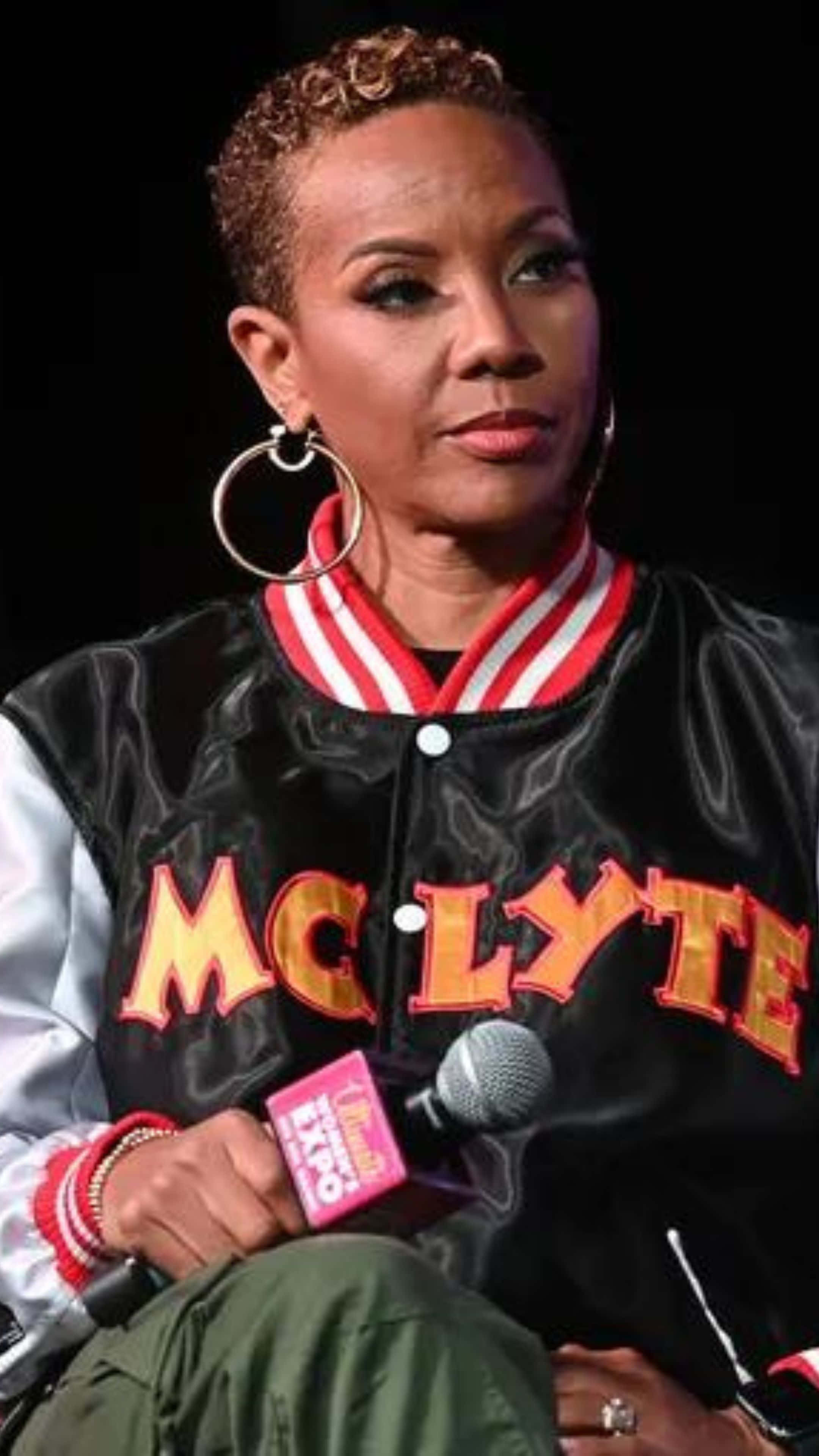 Mc Lyte, black satin jacket, bold orange letters, 4K Phone Wallpaper