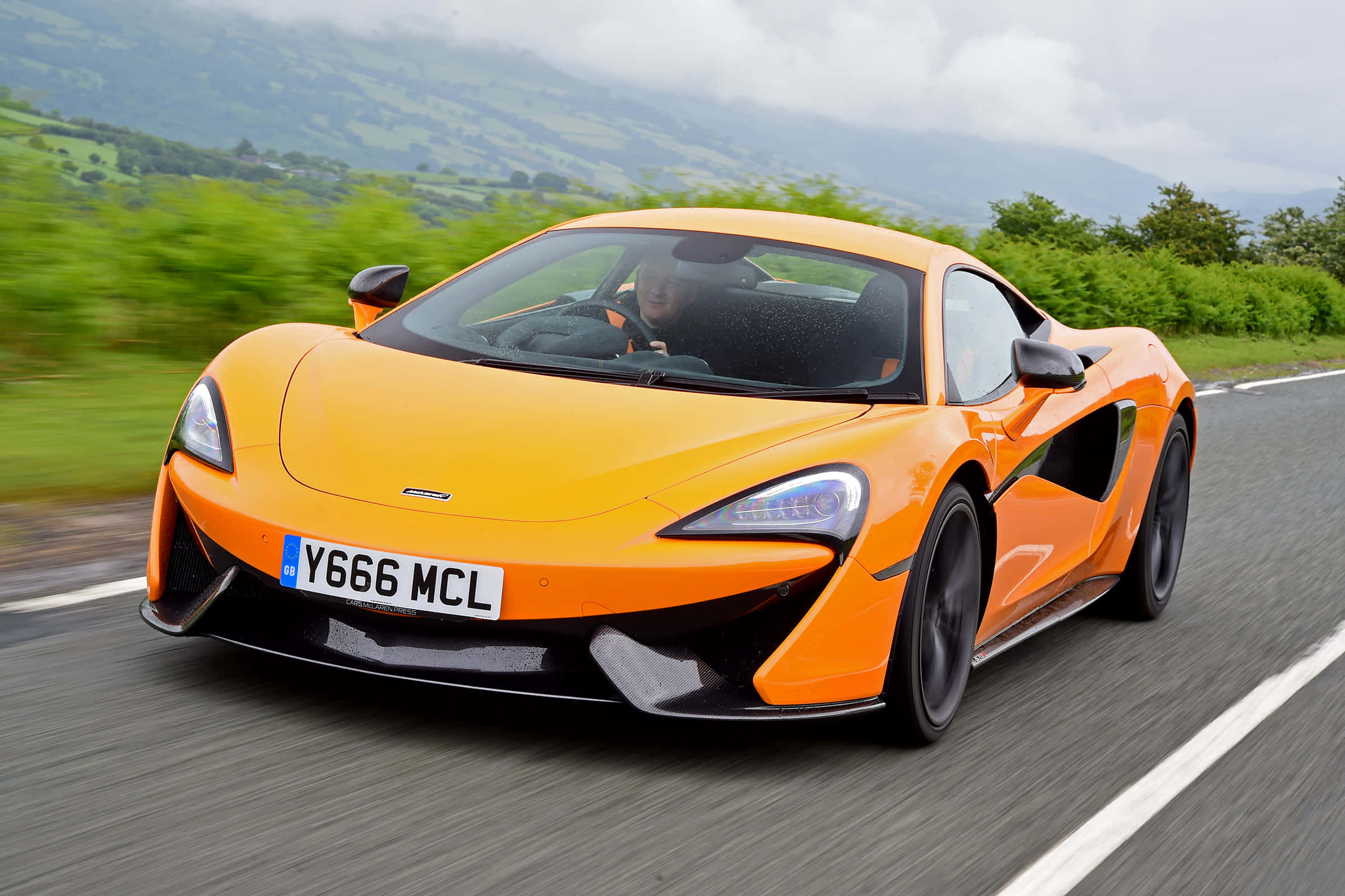 McLaren 570S, vibrant orange, winding rural road, Full HD Desktop Wallpaper