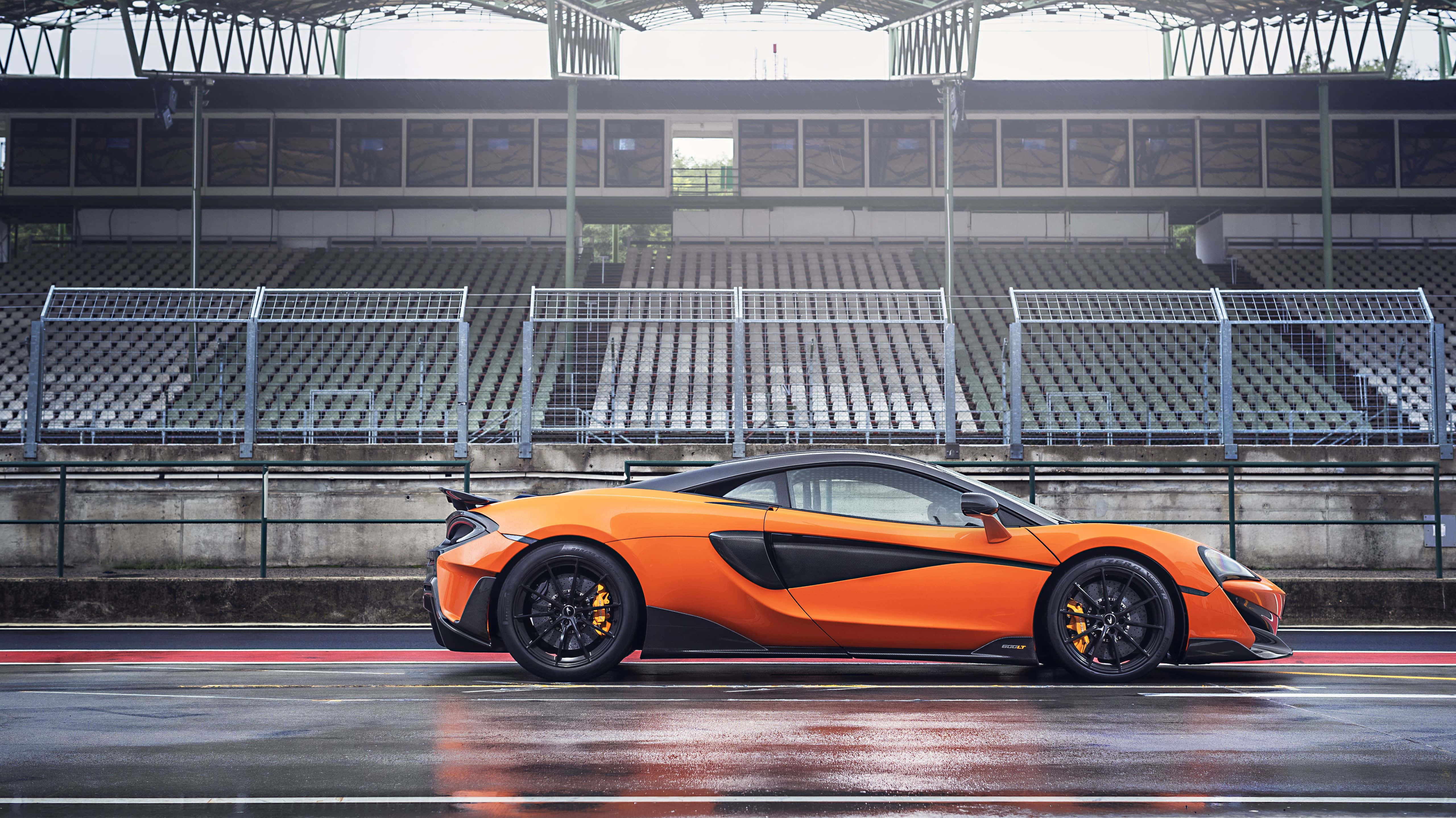 McLaren 600LT, vibrant orange, wet racetrack, 5K Desktop Wallpaper