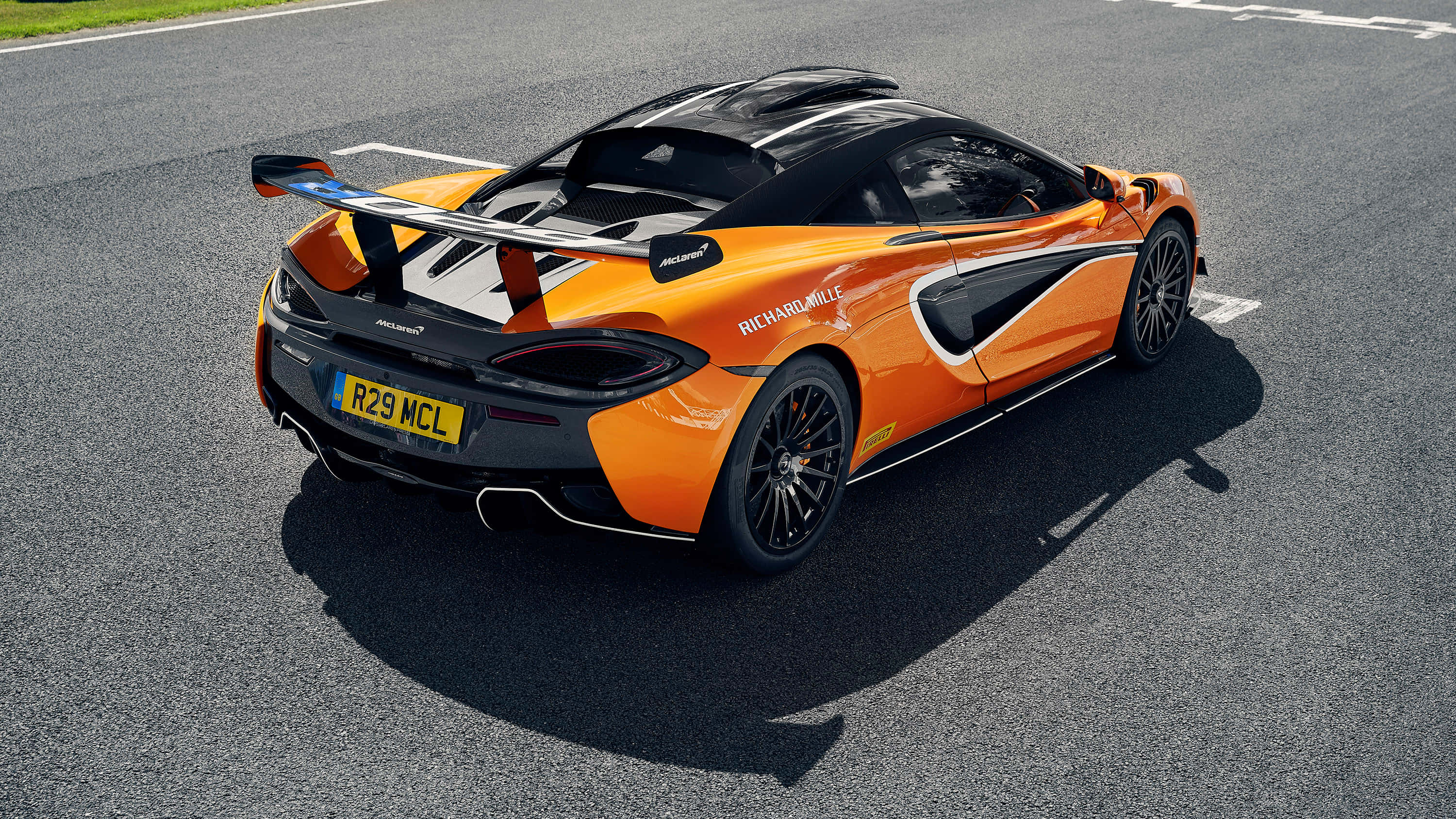 McLaren 620R, vibrant orange, black accents, 2K Desktop Wallpaper