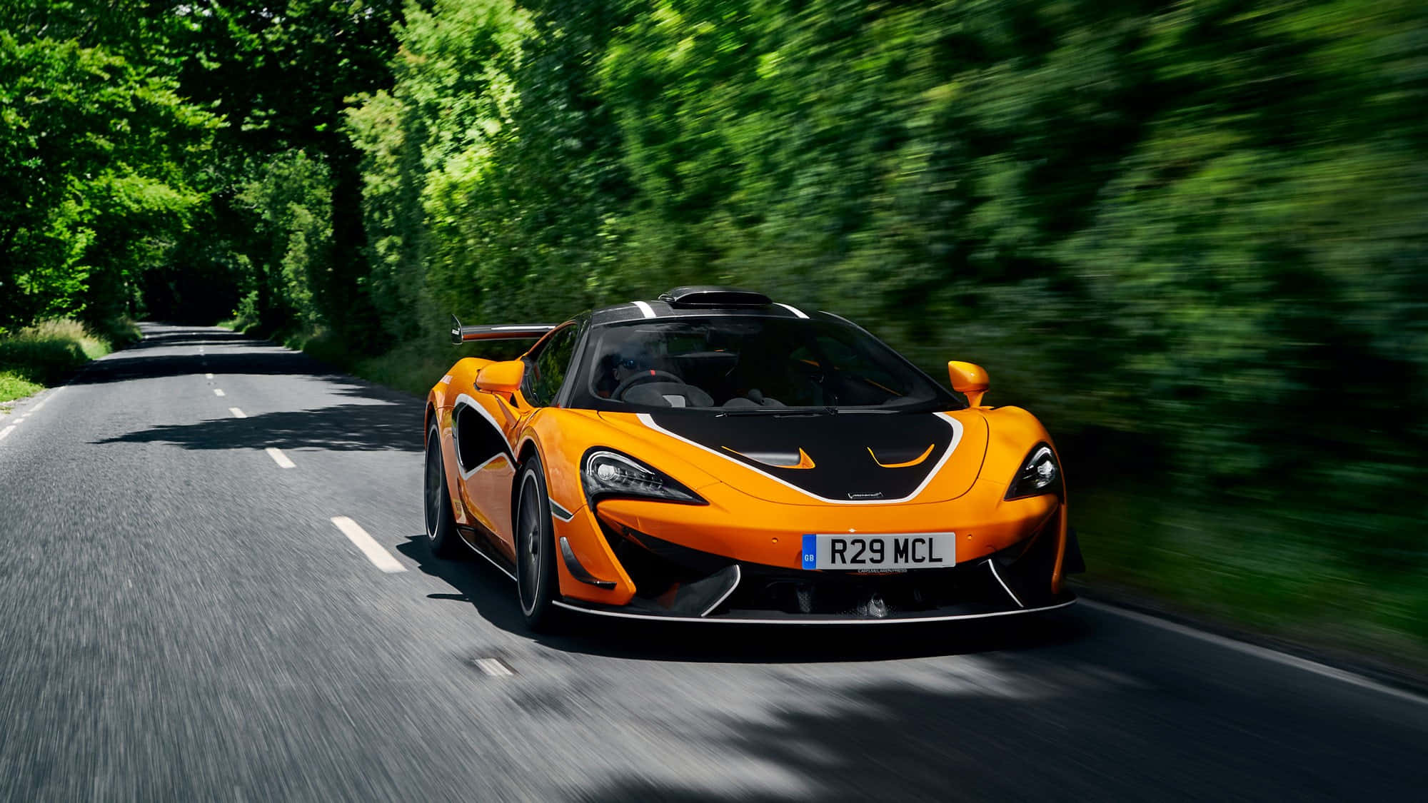McLaren 620R, vibrant orange, tree-lined road, Full HD Desktop Wallpaper