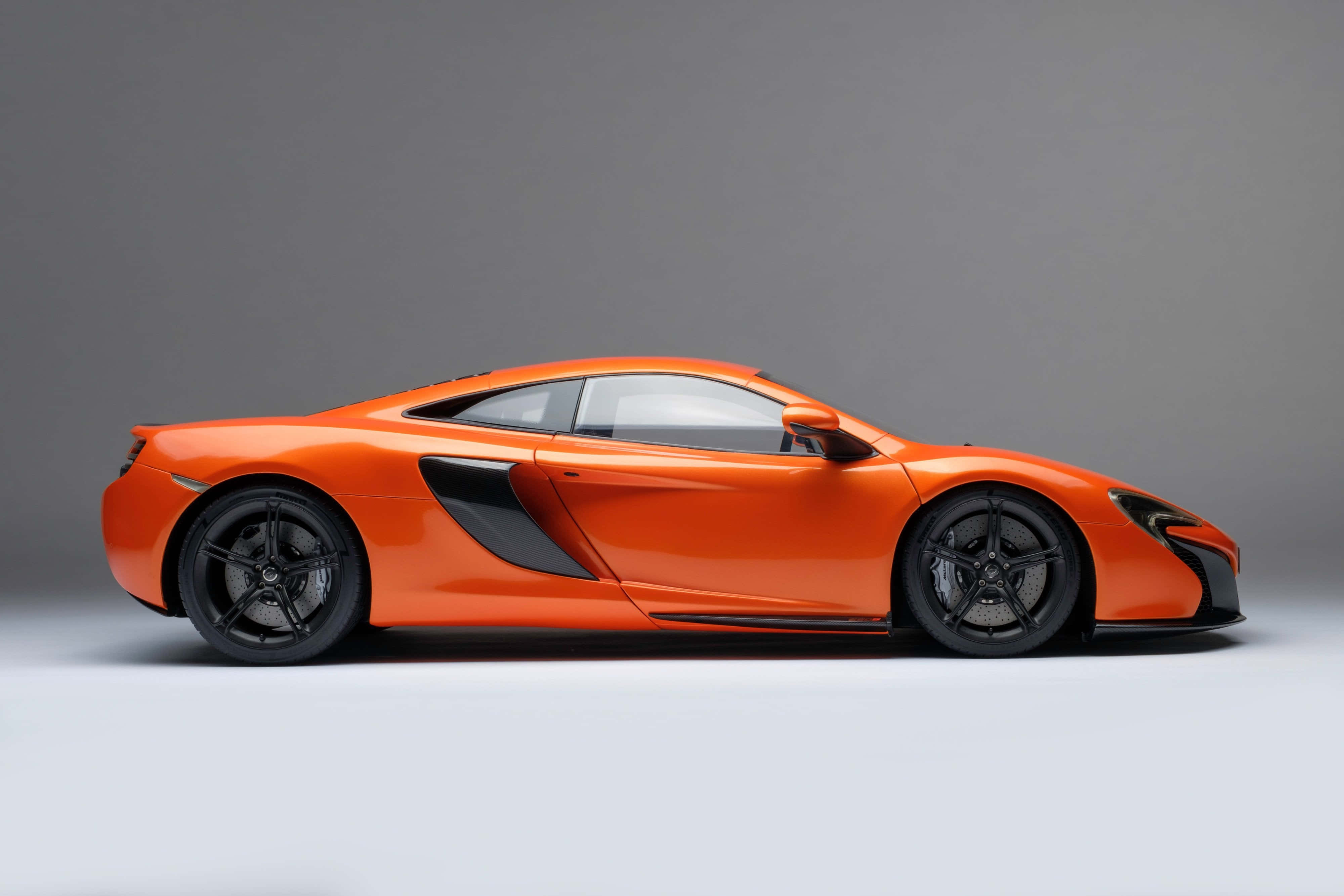 McLaren 650S, vibrant orange, profile view, 4K Desktop Wallpaper