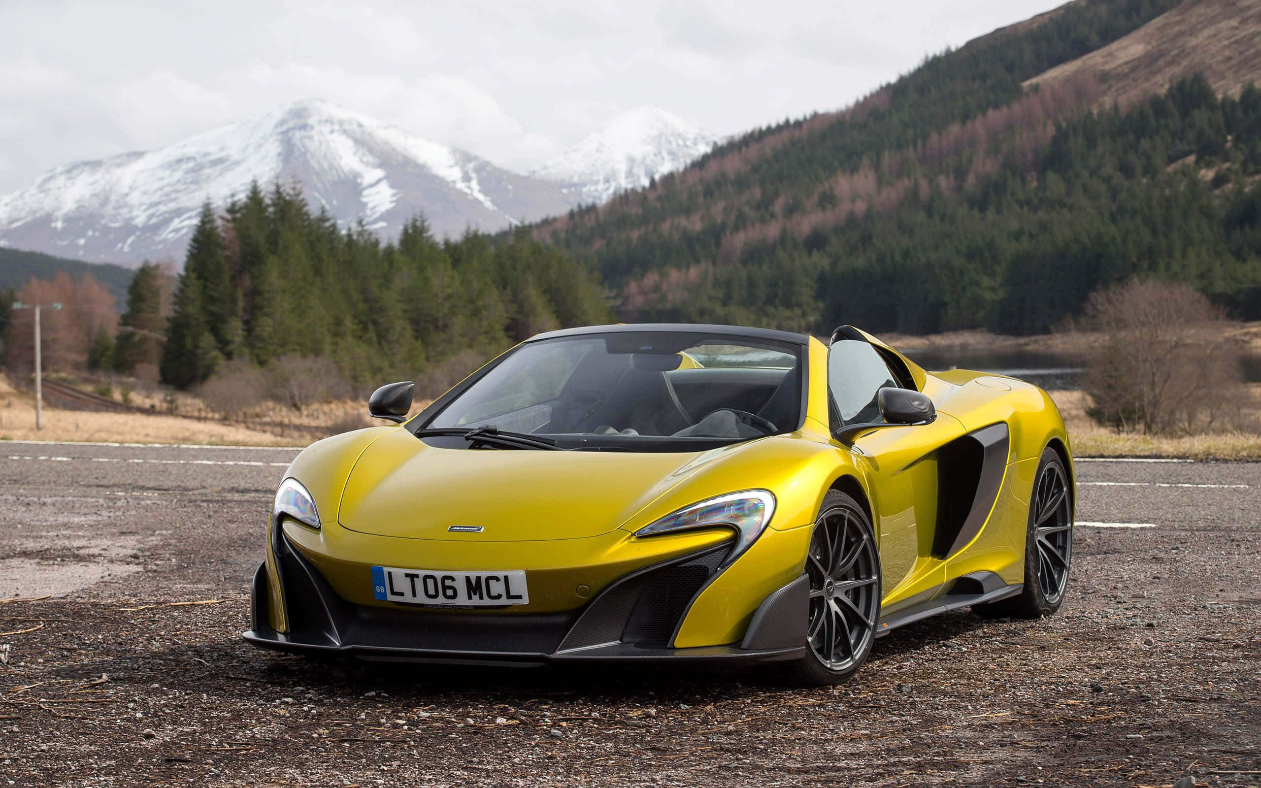 McLaren 675LT, vibrant yellow, gravel lot, 2K Desktop Wallpaper
