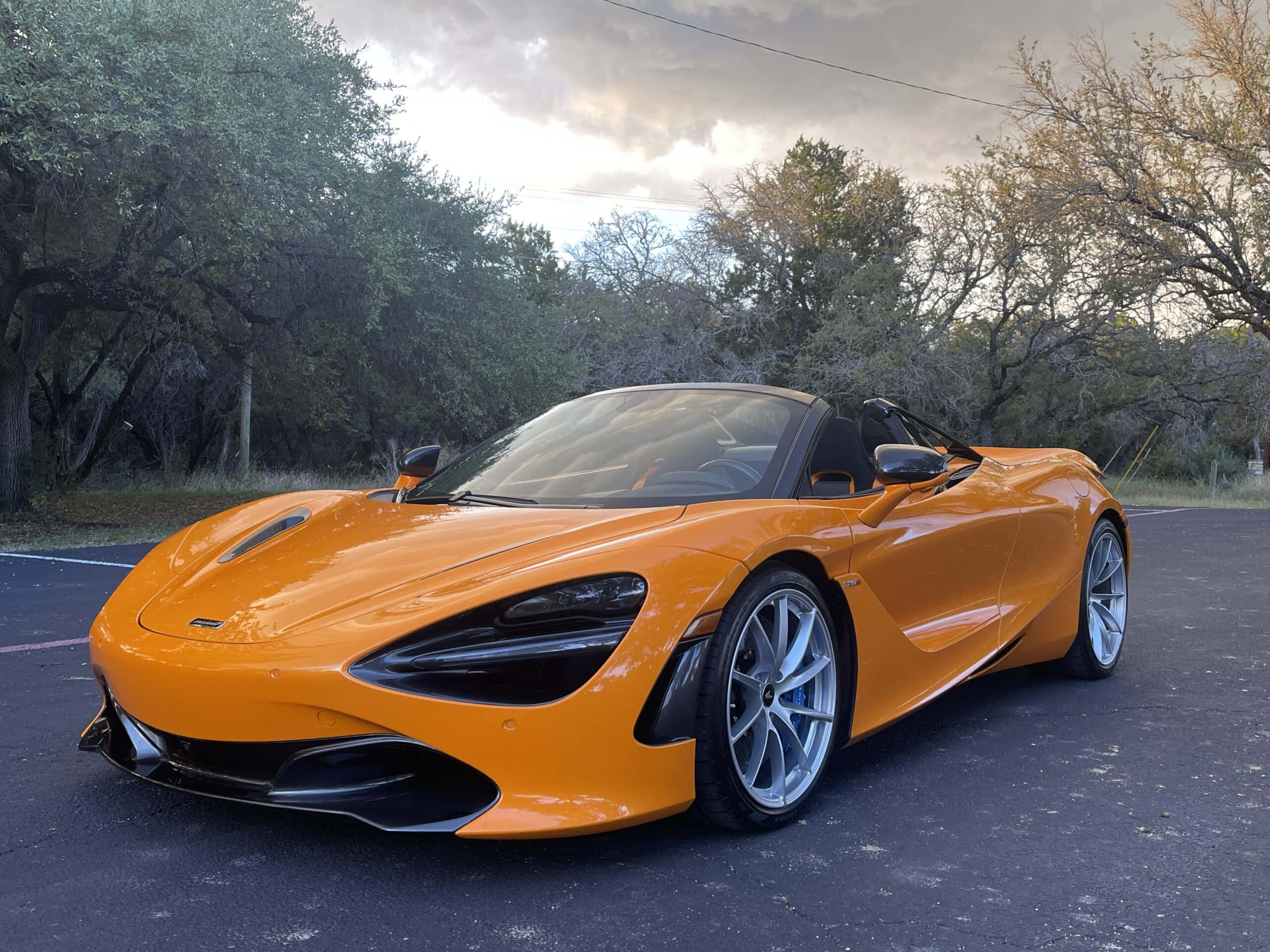 McLaren 720S Spider, vibrant orange, parked in a lot, 2K Desktop Wallpaper