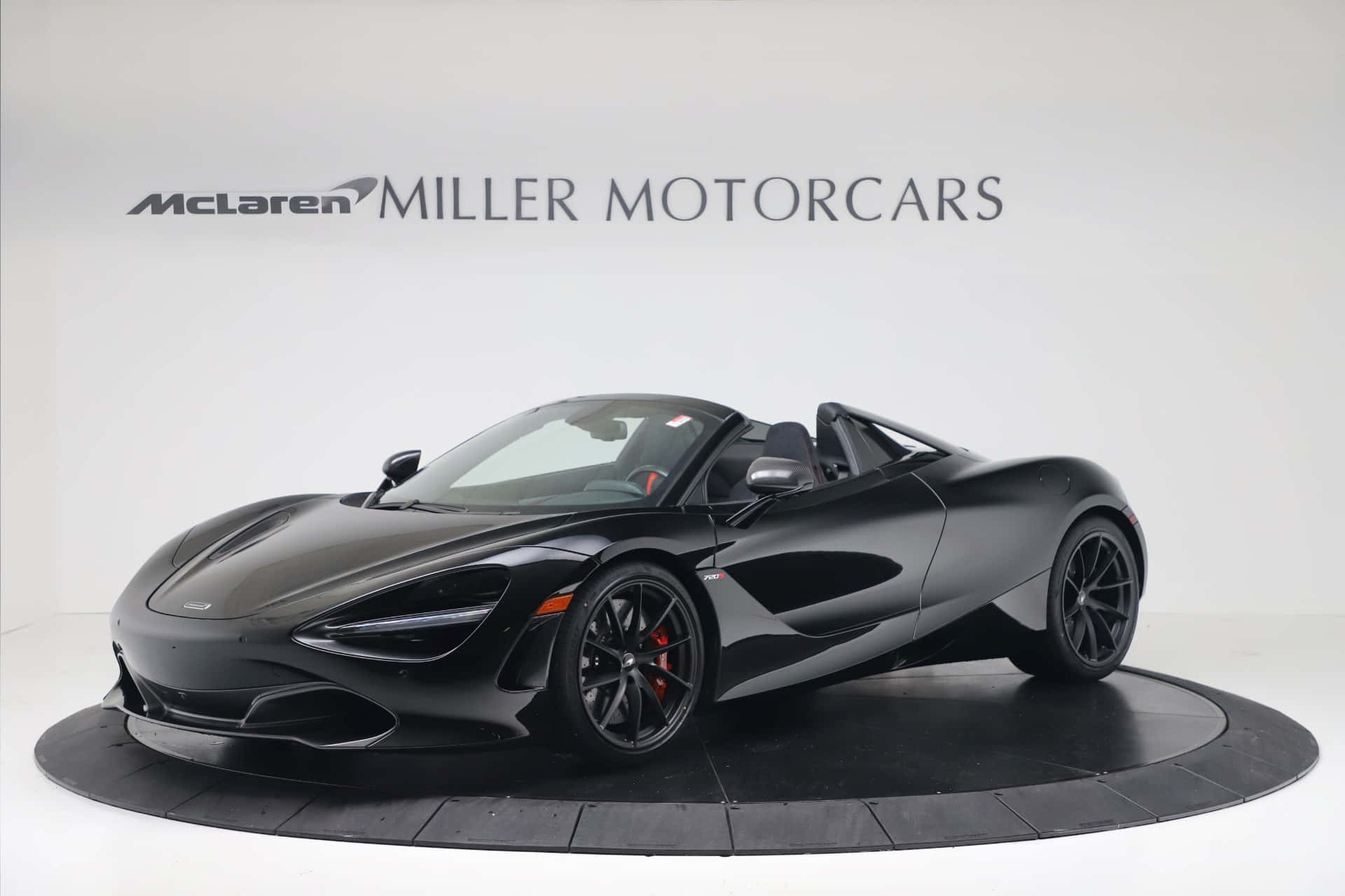 McLaren 720S Spider, sleek black, circular platform, Full HD Desktop Wallpaper
