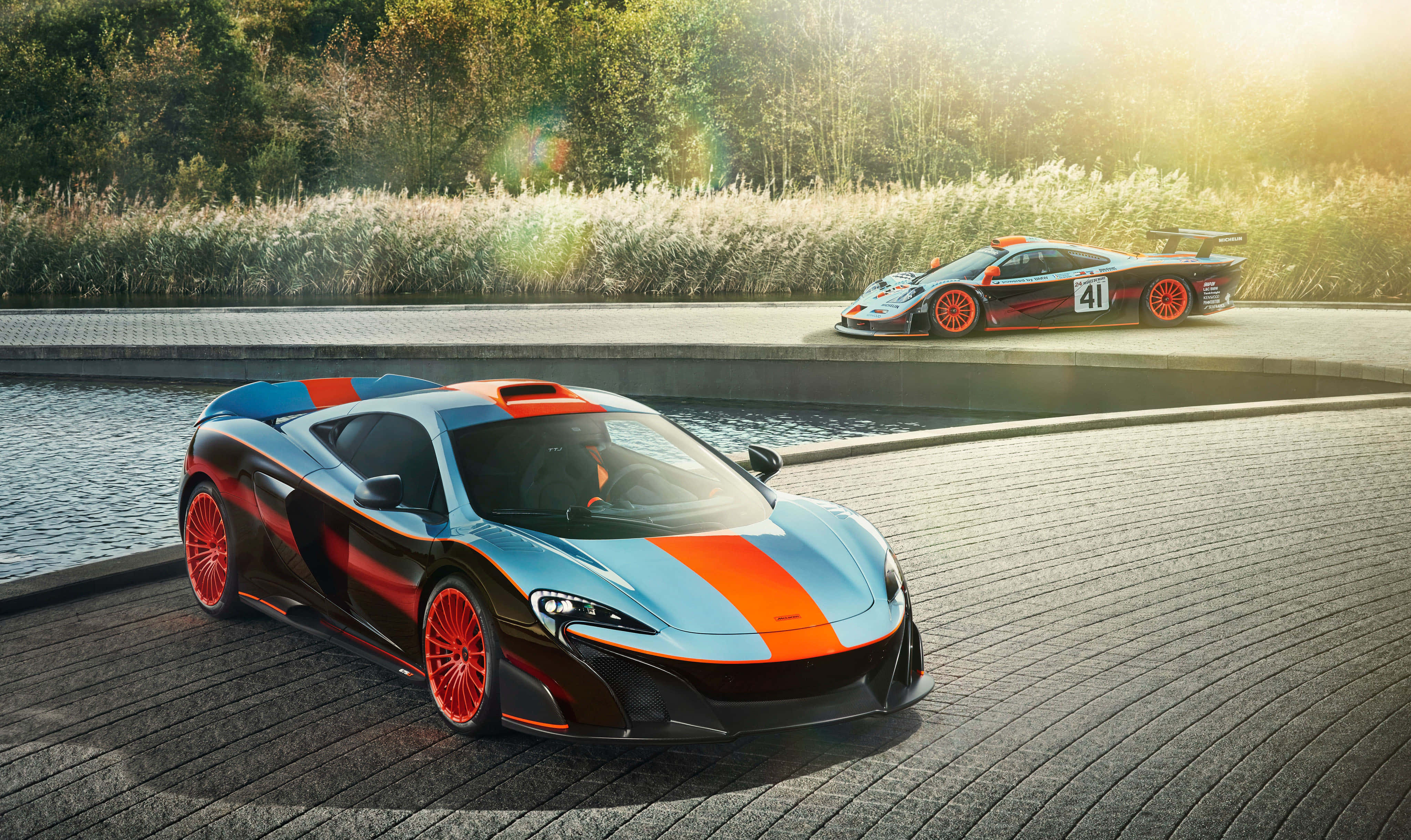 McLaren F1, orange accents, wet cobblestone path, 4K Desktop Wallpaper