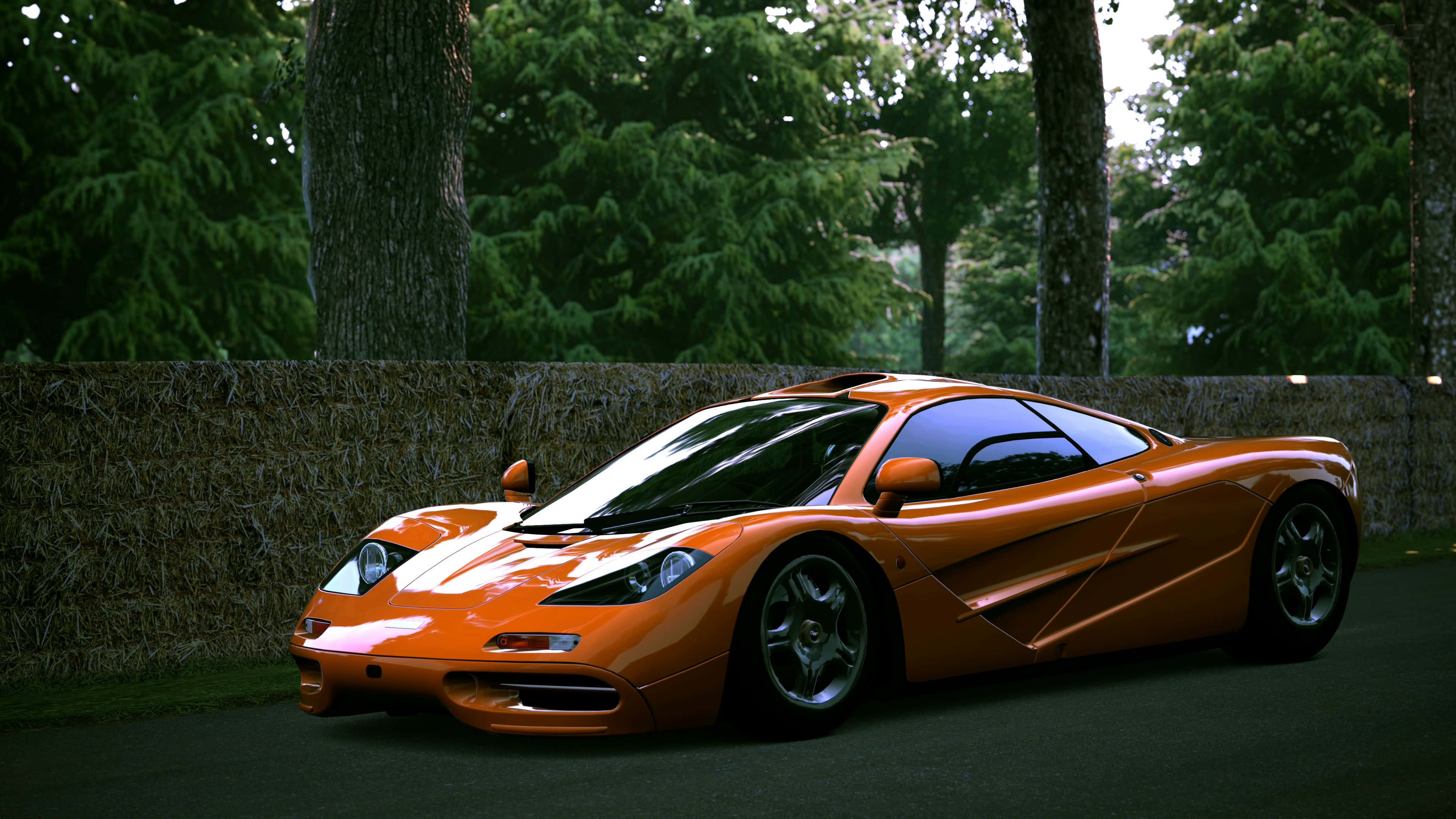 McLaren F1, vibrant orange, hay bales, 4K Desktop Wallpaper