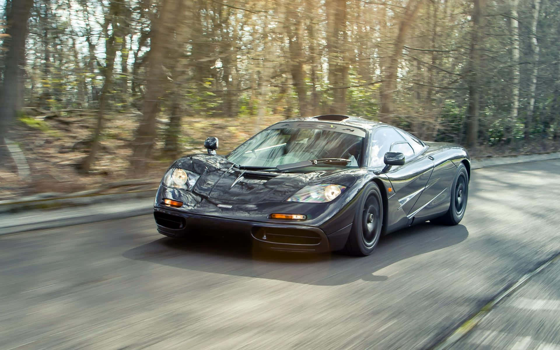 McLaren F1, black, sunlit forest, Full HD Desktop Wallpaper