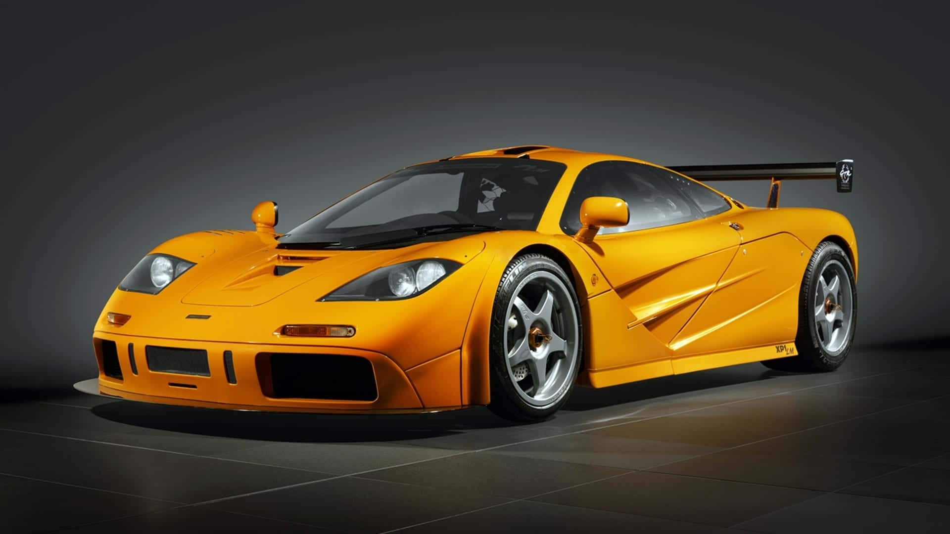 McLaren F1, vibrant orange, large rear wing, Full HD Desktop Wallpaper