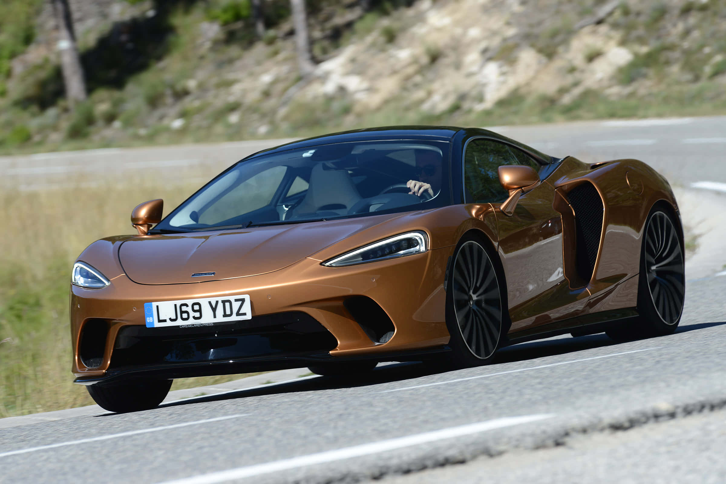 McLaren GT, bronze, winding mountain road, Full HD Desktop Wallpaper