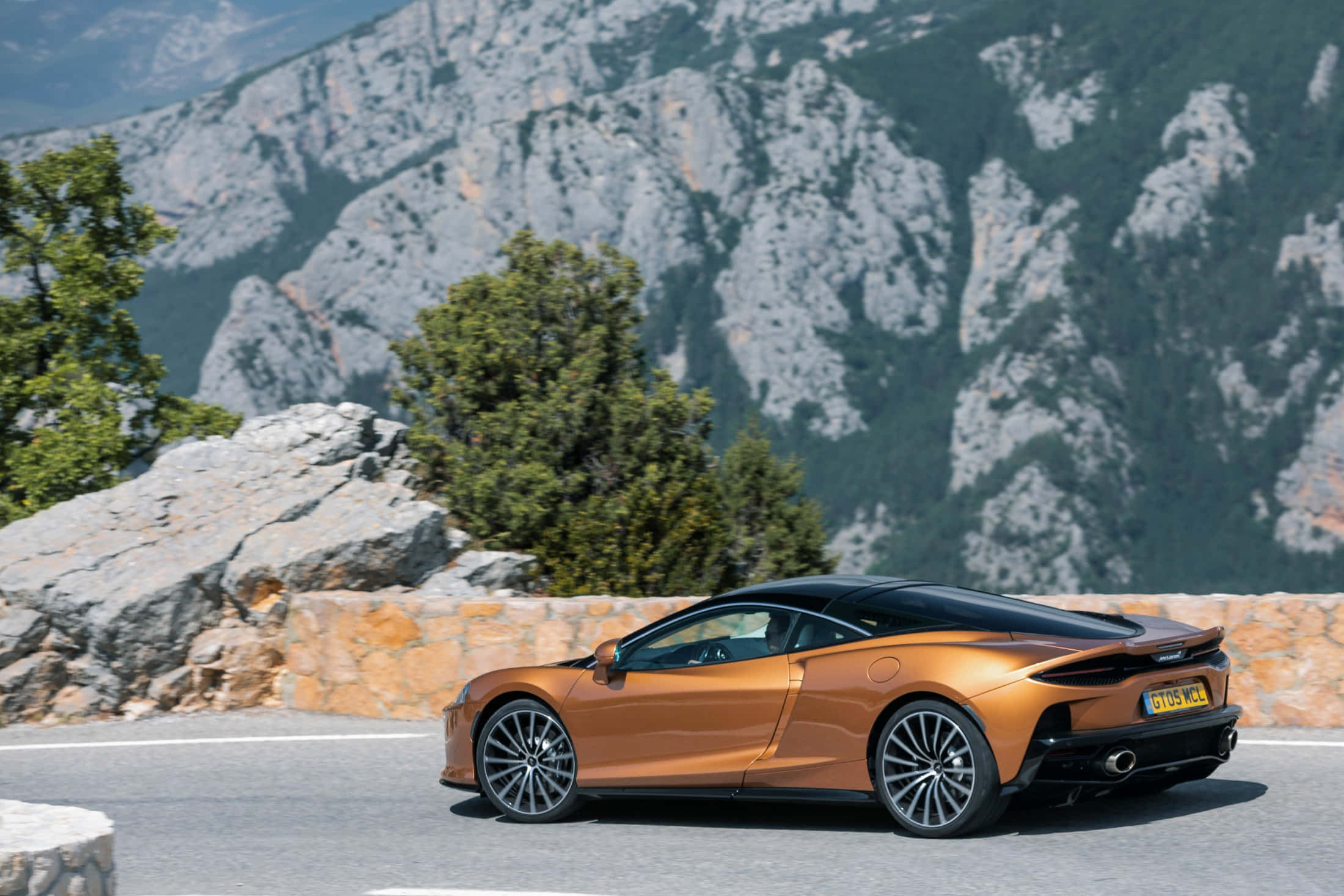 McLaren GT, orange, mountain road, Full HD Desktop Wallpaper
