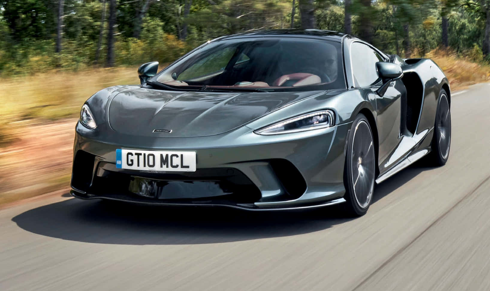 McLaren GT, grey, forest-lined road, HD Desktop Wallpaper