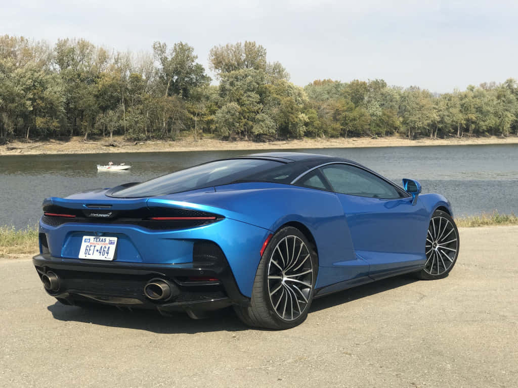 McLaren GT, vibrant blue, open road, SD Desktop Wallpaper