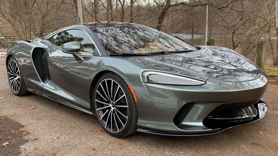 McLaren GT, matte green, gravel path, SD Desktop Wallpaper