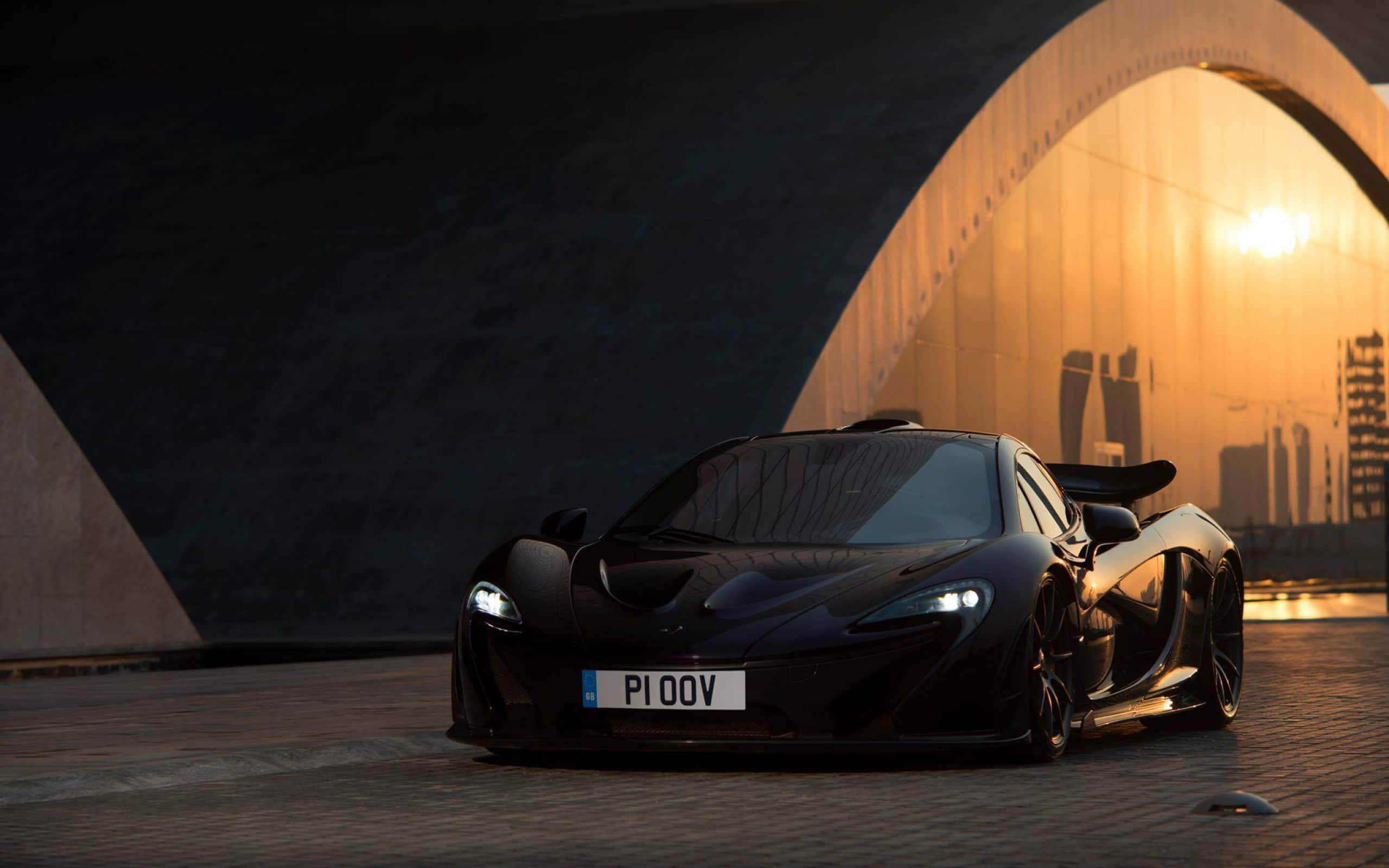 McLaren P1, sleek black, golden sunset light, 2K Desktop Wallpaper