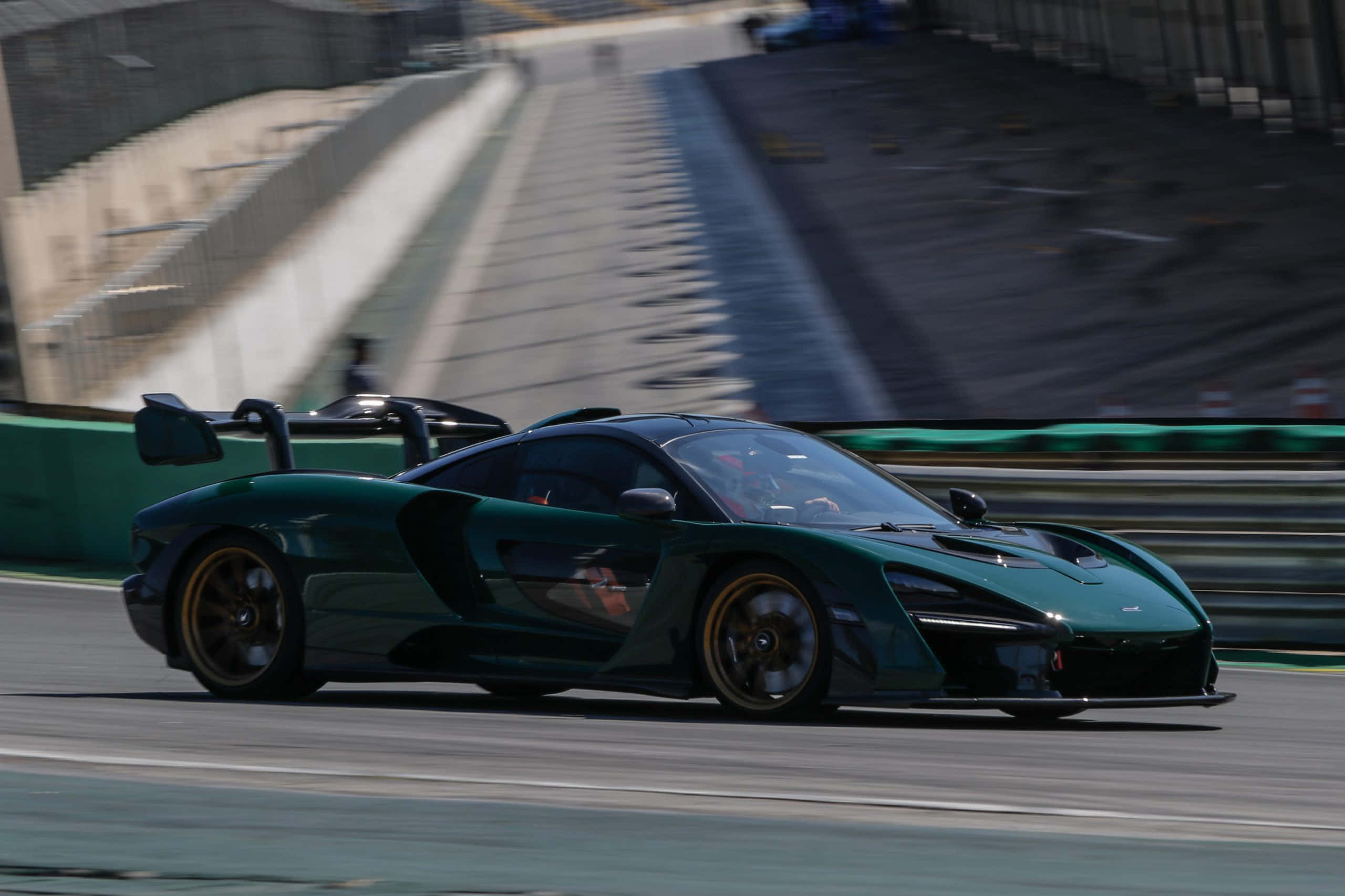 McLaren Senna, sleek green, sunlit track, 2K Desktop Wallpaper