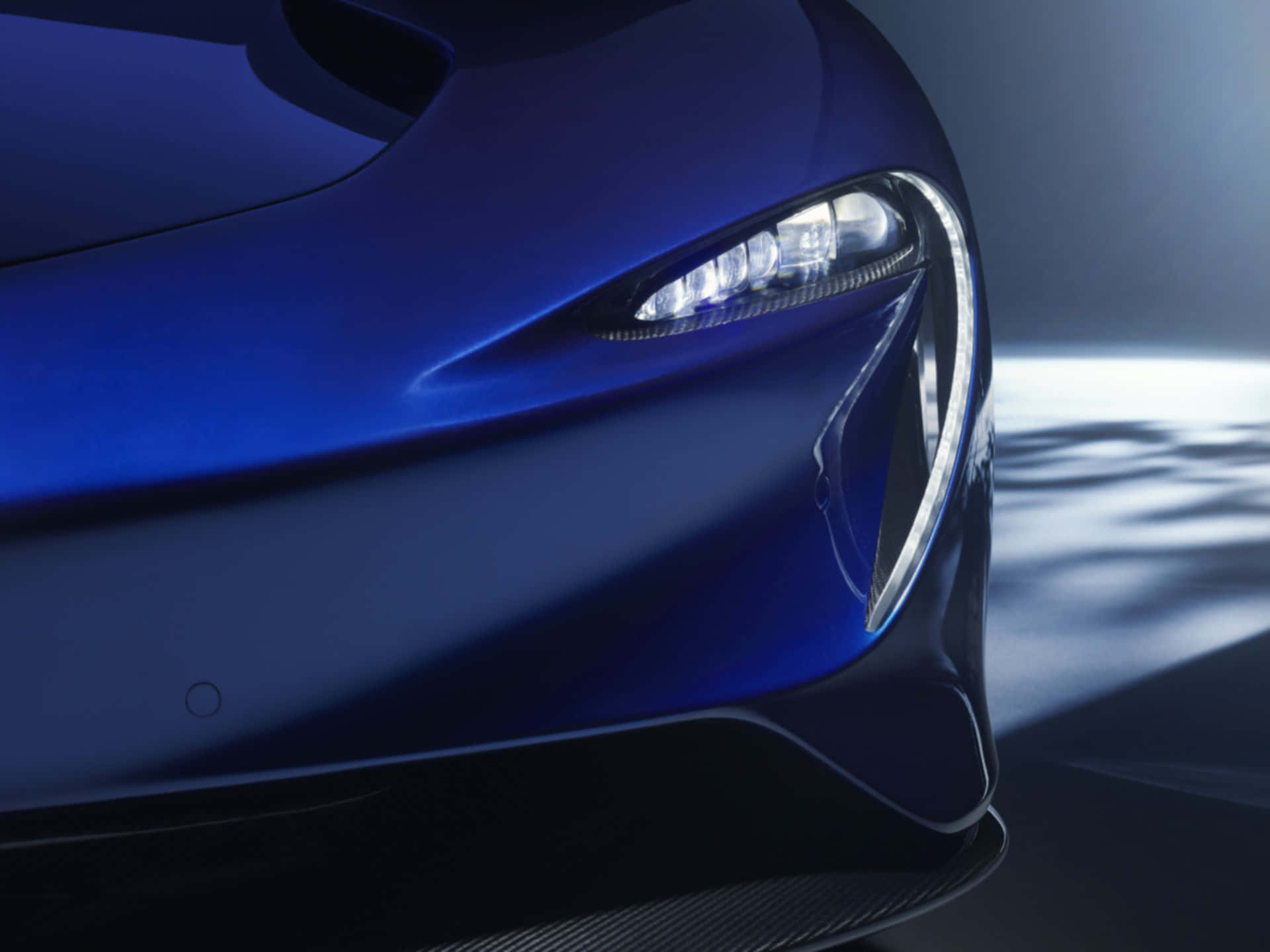 McLaren Speedtail, sleek blue sports car, glowing headlight, Full HD Desktop Wallpaper