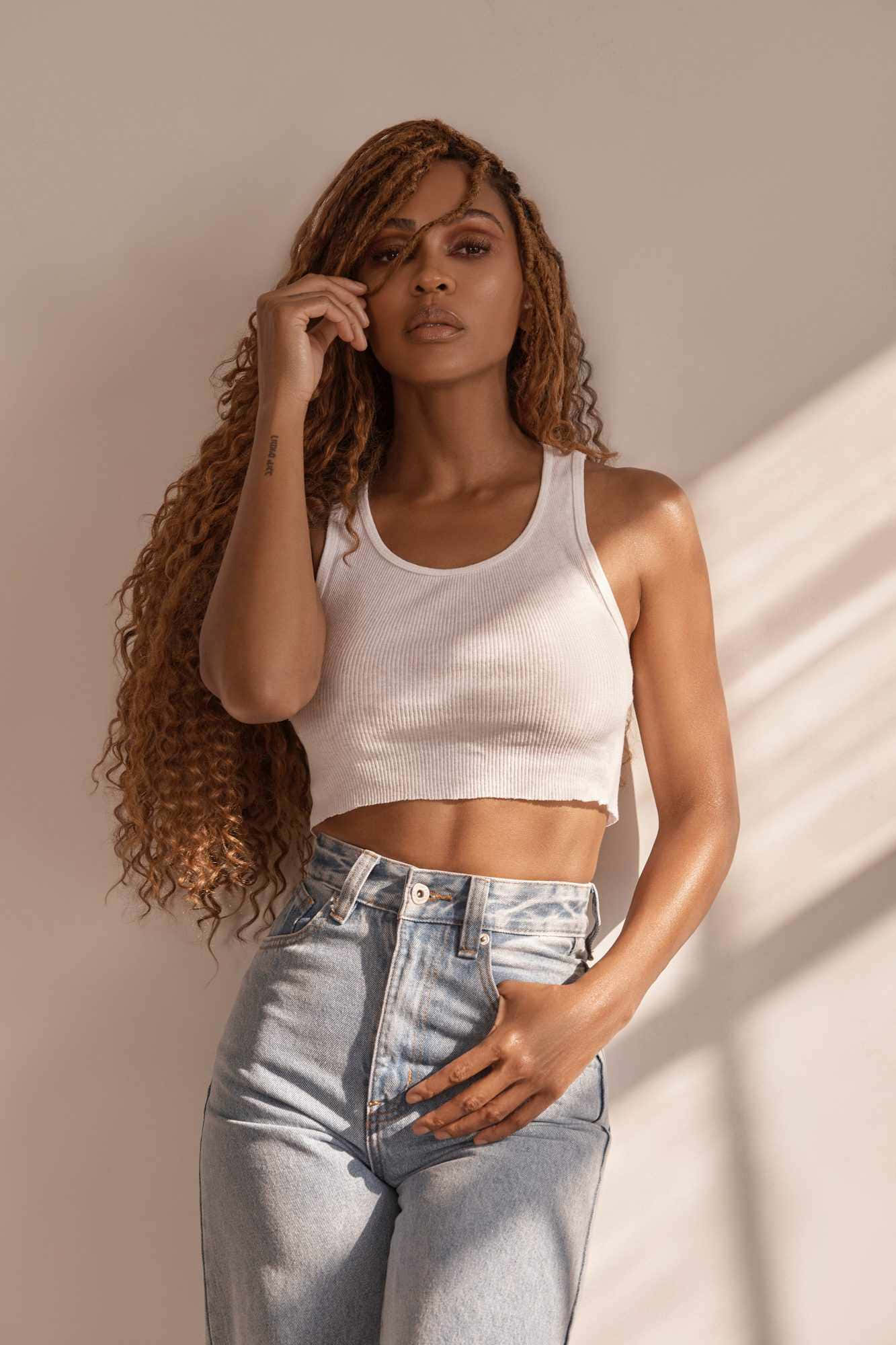 Meagan Good, white crop top, light blue jeans, Full HD Phone Wallpaper