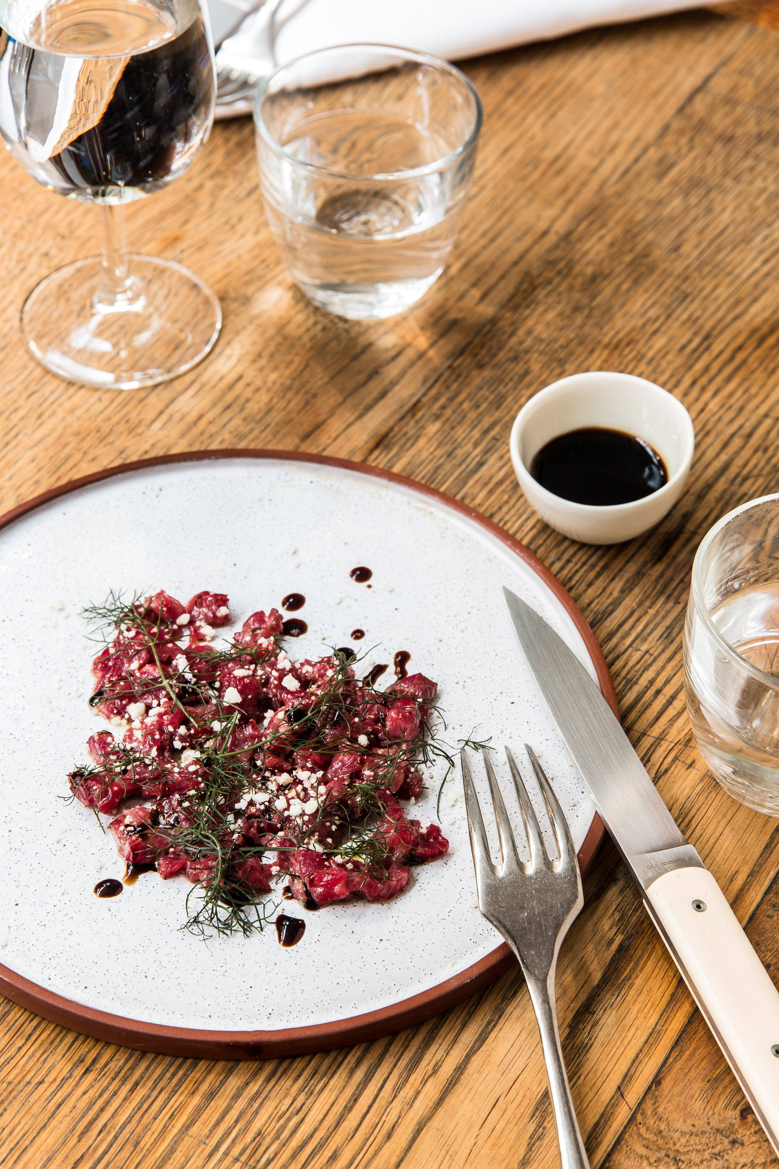 minced steak tartare, rustic wooden table, plate of raw beef tartare, 4K Phone Wallpaper
