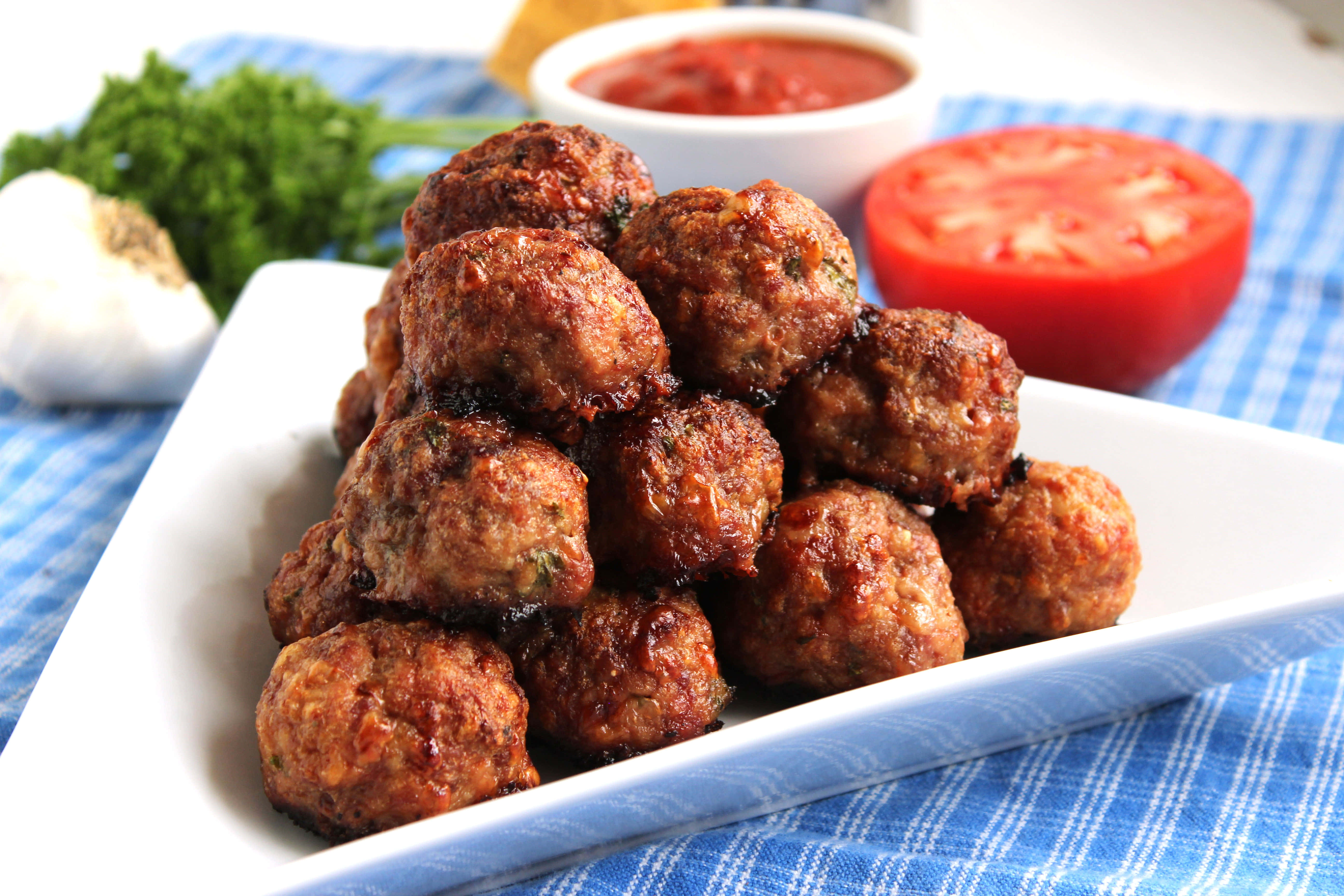 juicy meatballs, white plate, halved tomato, 5K Desktop Wallpaper