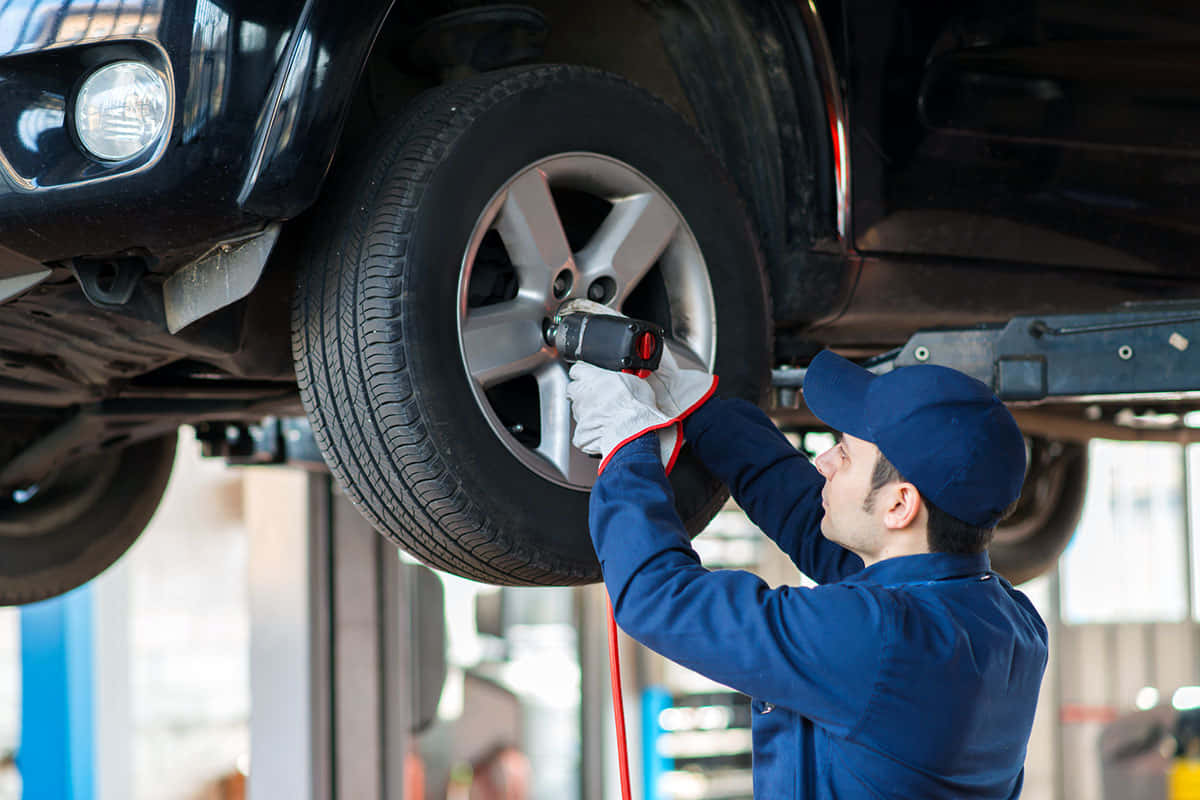 blue uniform, impact wrench, black SUV, SD Desktop Wallpaper
