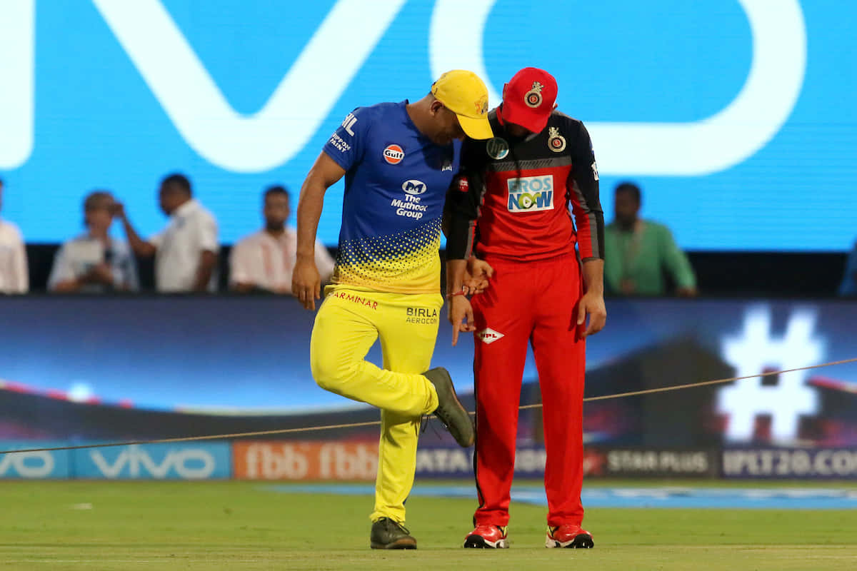 cricket players, vibrant team uniforms, brightly lit stadium field, SD Desktop Wallpaper