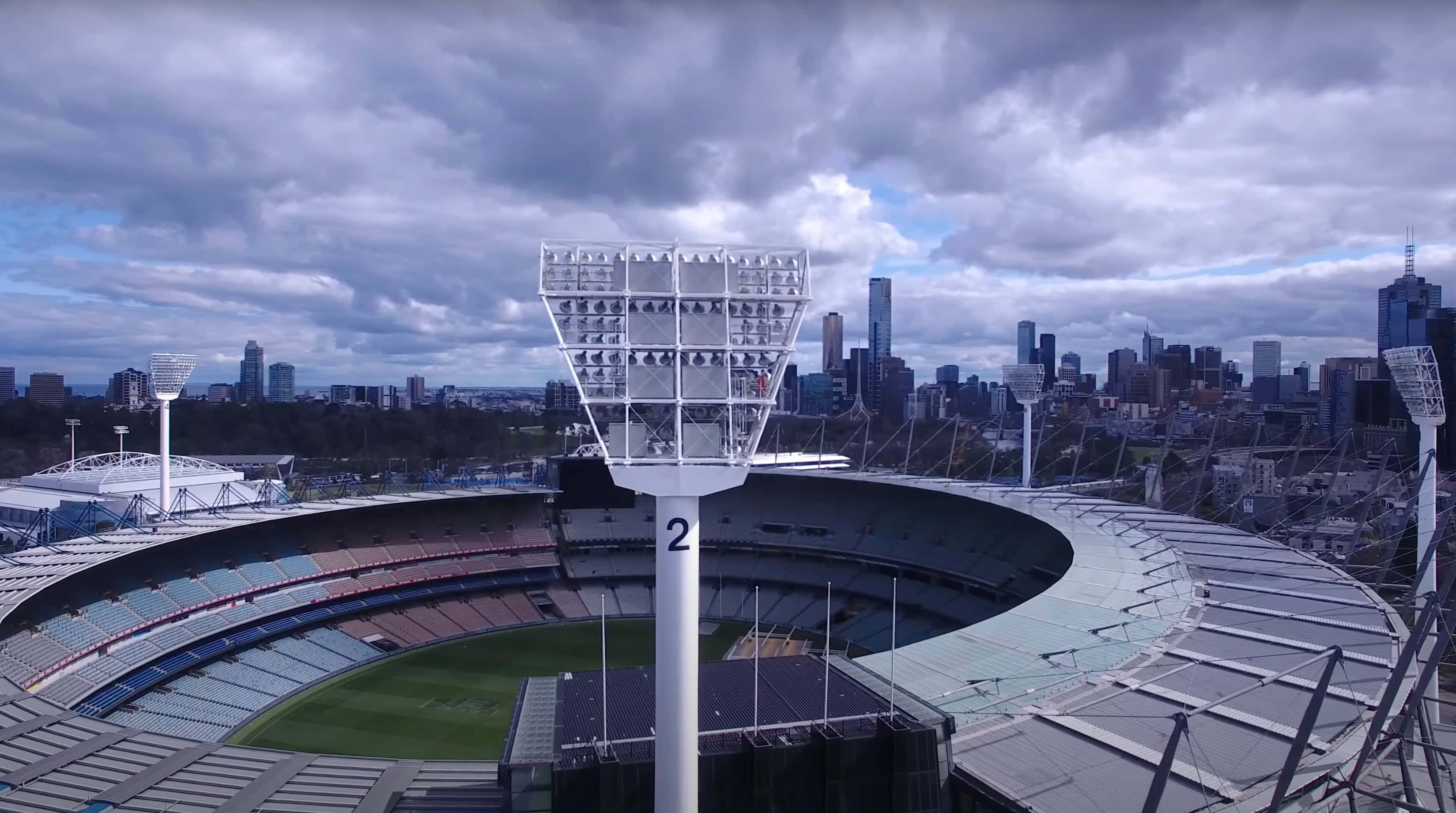 Melbourne Cricket Ground, aerial view, towering floodlights, 2K Desktop Wallpaper