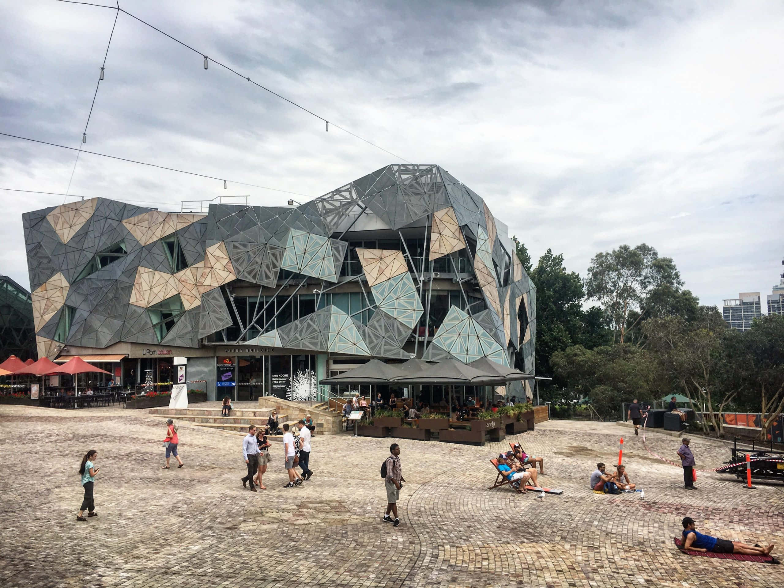 Melbourne Federation Square, glass and metal facets, cloudy sky, 2K Desktop Wallpaper