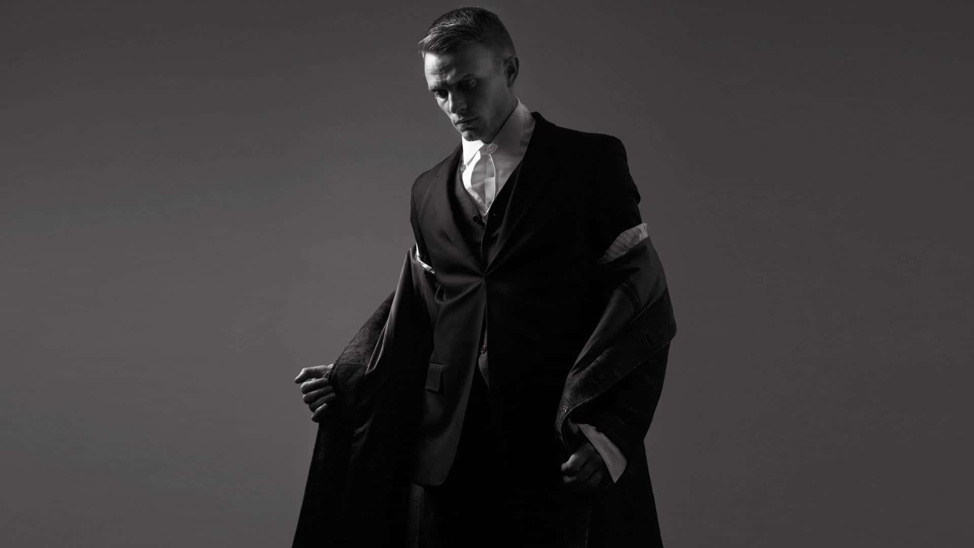 dark suit, gray backdrop, dramatic lighting, Full HD Desktop Wallpaper