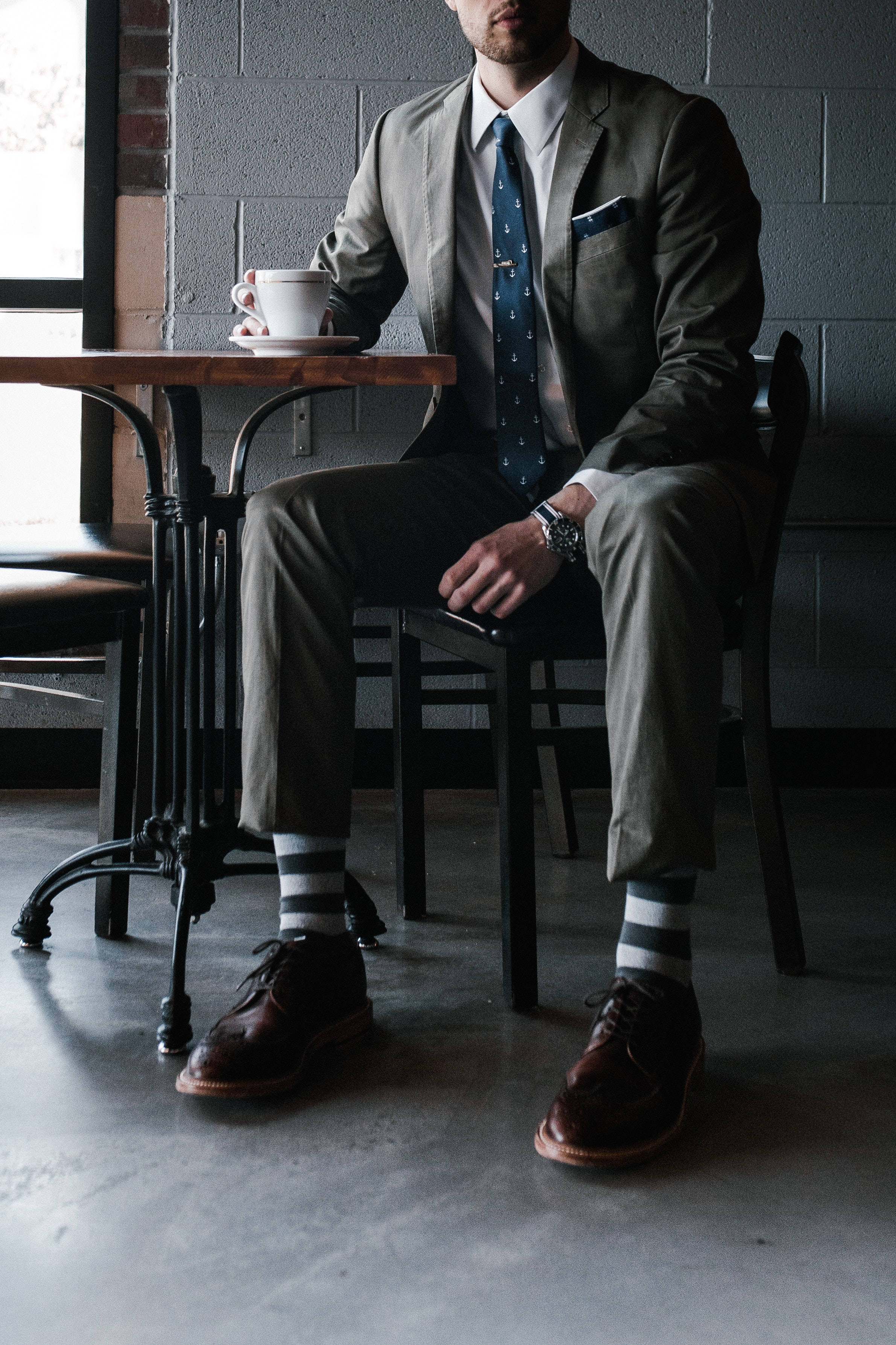 gray suit, wooden table, coffee cup, 2K Phone Wallpaper
