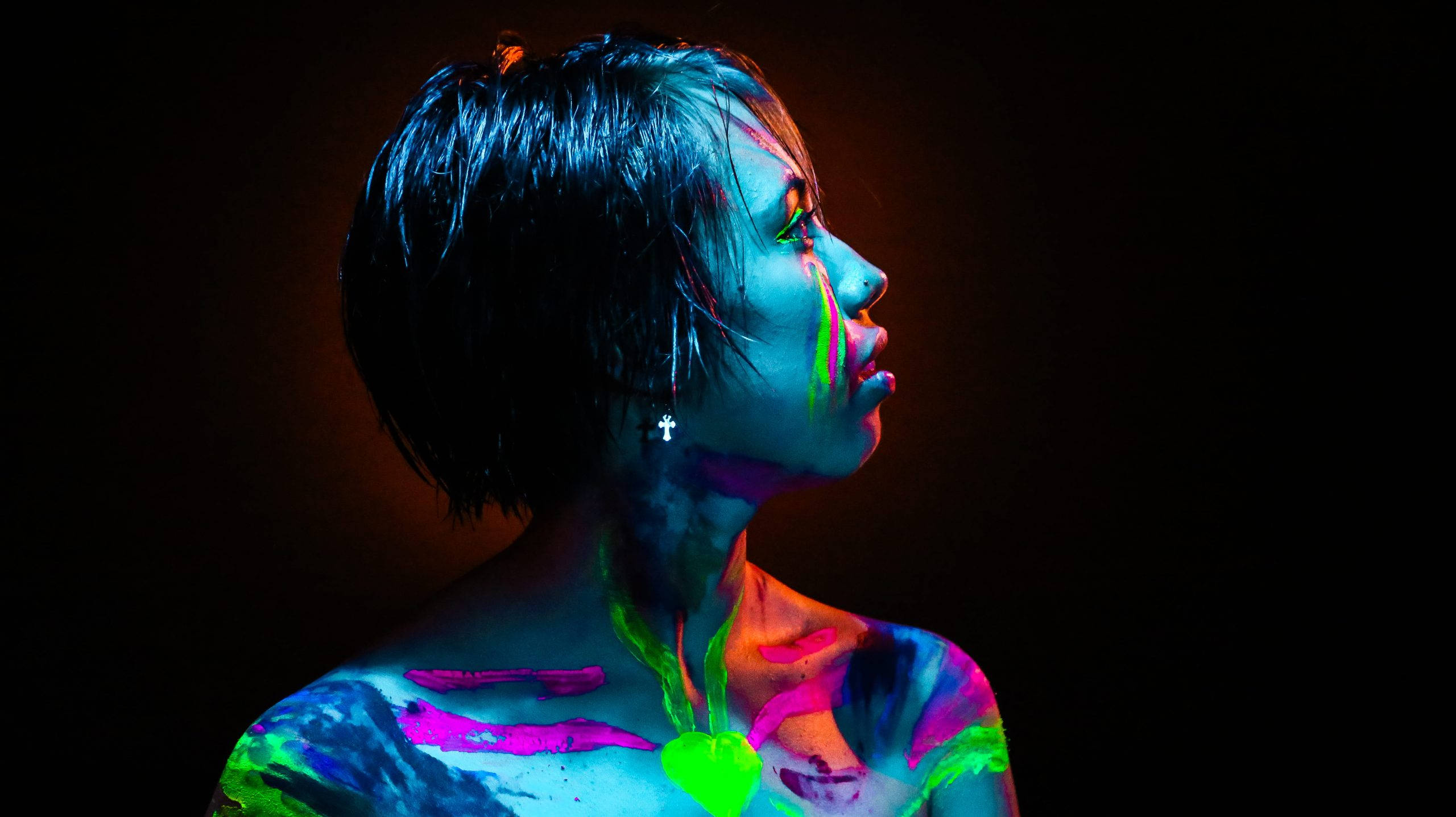 neon paint streaks, black background, short dark hair, 2K Desktop Wallpaper